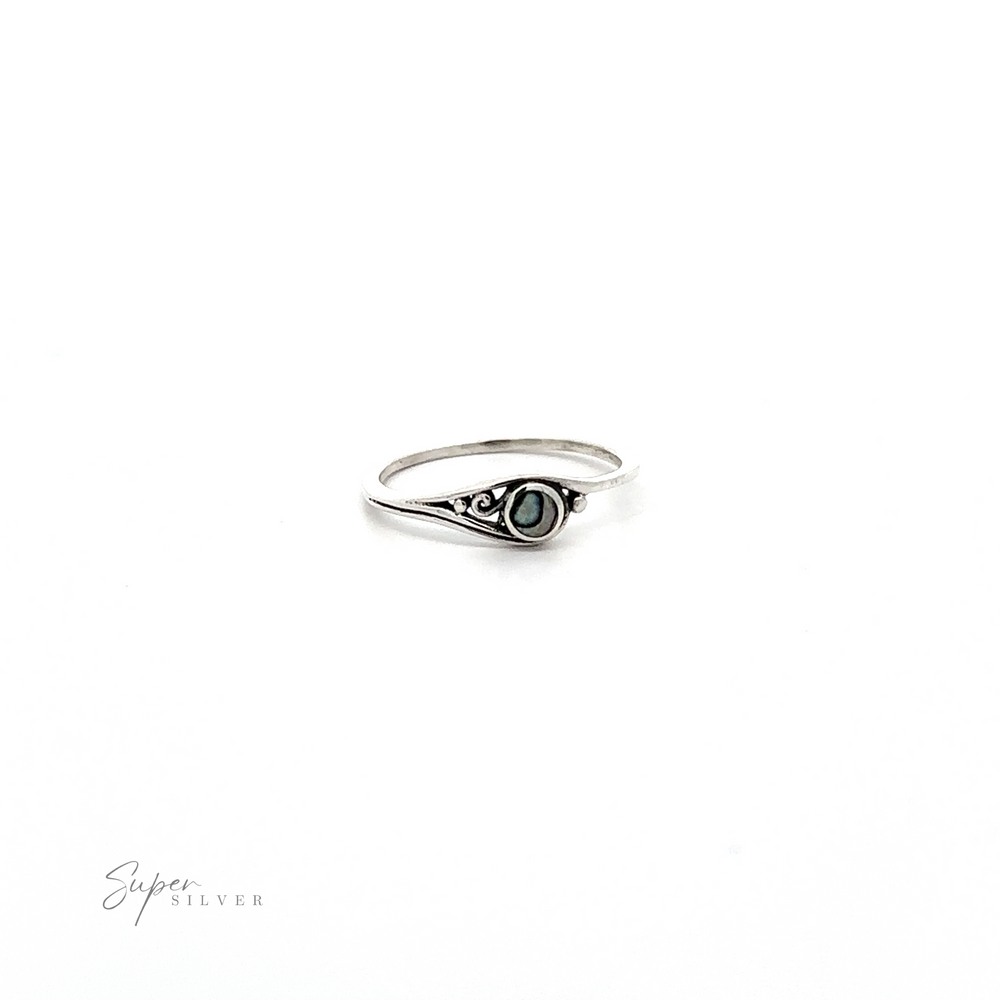 
                  
                    A sterling silver ring with a green Delicate Inlay Stone featuring a Small Swirl Design.
                  
                