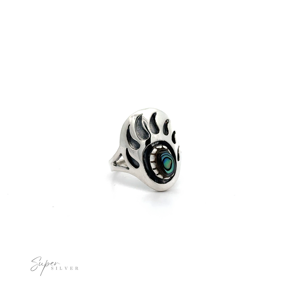 
                  
                    A silver Stone Bear Paw Ring with a turquoise stone in the middle.
                  
                
