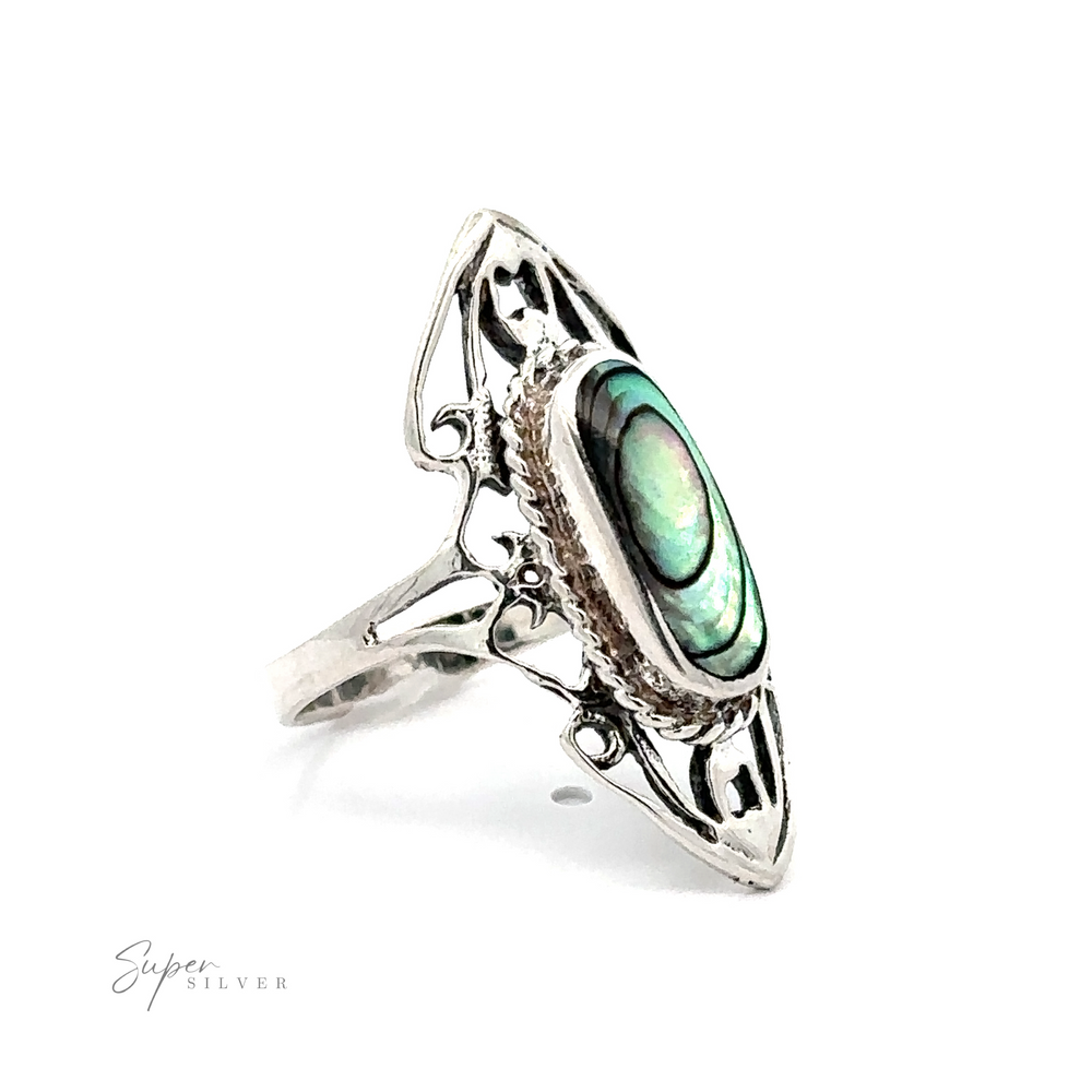 
                  
                    Elongated filigree ring with an oval abalone shell inlay on a white background.
                  
                