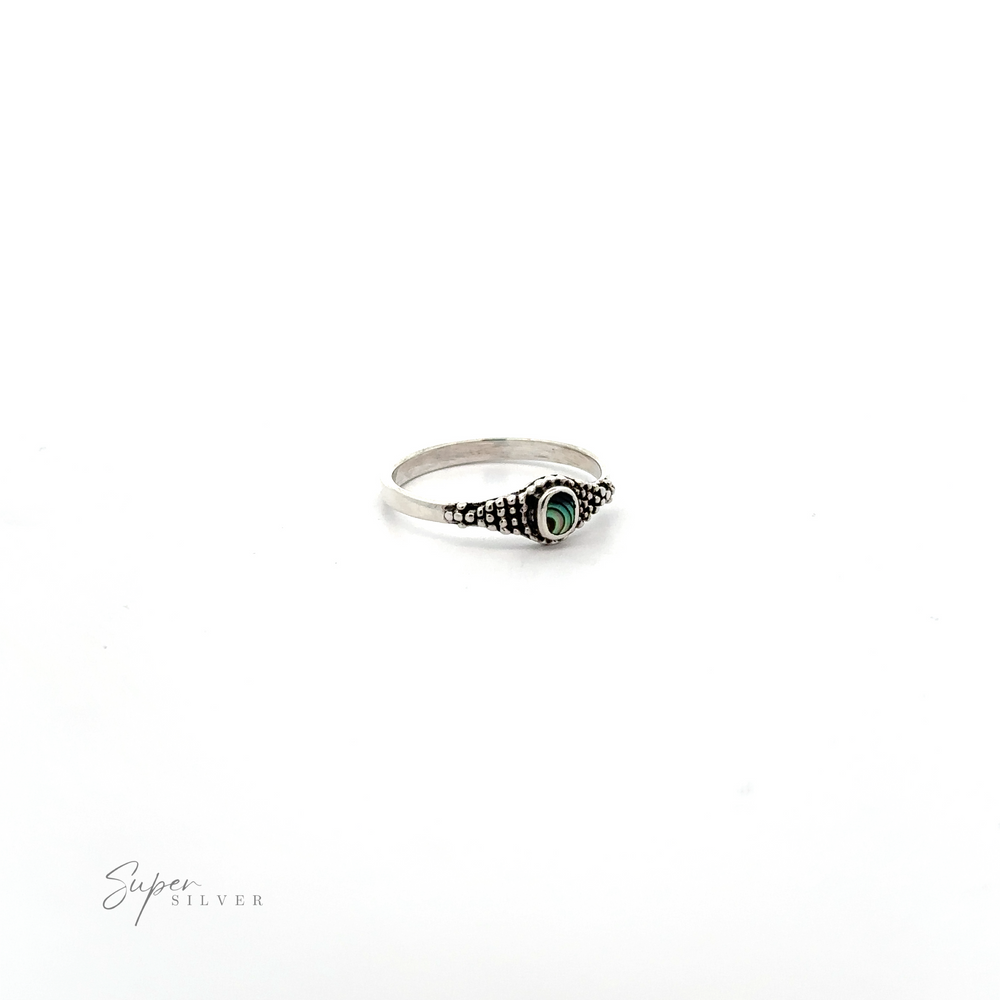 
                  
                    A Dainty Inlaid Ring with Beaded Texture featuring Bali-style beading.
                  
                
