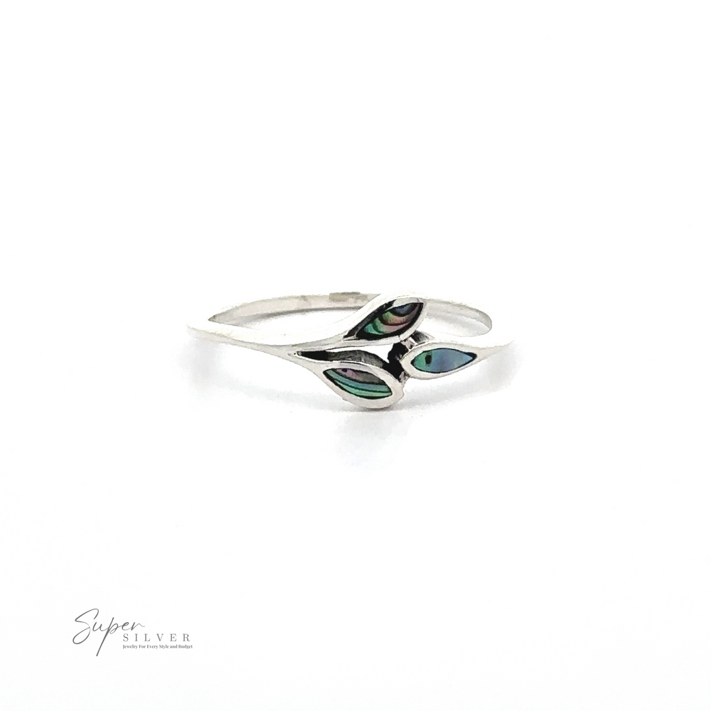 
                  
                    A sterling silver ring with a delicate, twisting band design featuring two small, multicolored inlay accents. The text "Tiny Leaves Ring with Inlaid Stones" is visible in the bottom corner, making this minimalist ring truly stand out.
                  
                