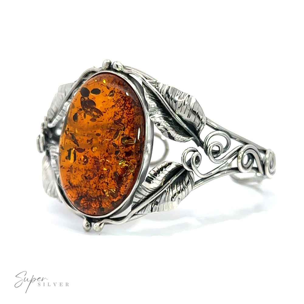 An contemporary design silver ring with an Exquisite Amber Floral Cuff.