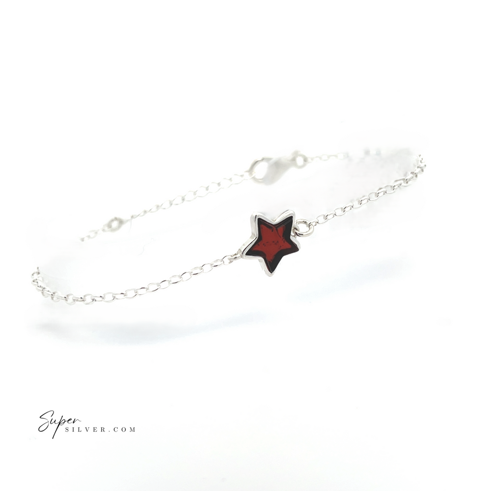 
                  
                    The Simple Amber Star Bracelet is a minimalist chain accessory made from sterling silver, highlighted by a red star-shaped charm in the center.
                  
                