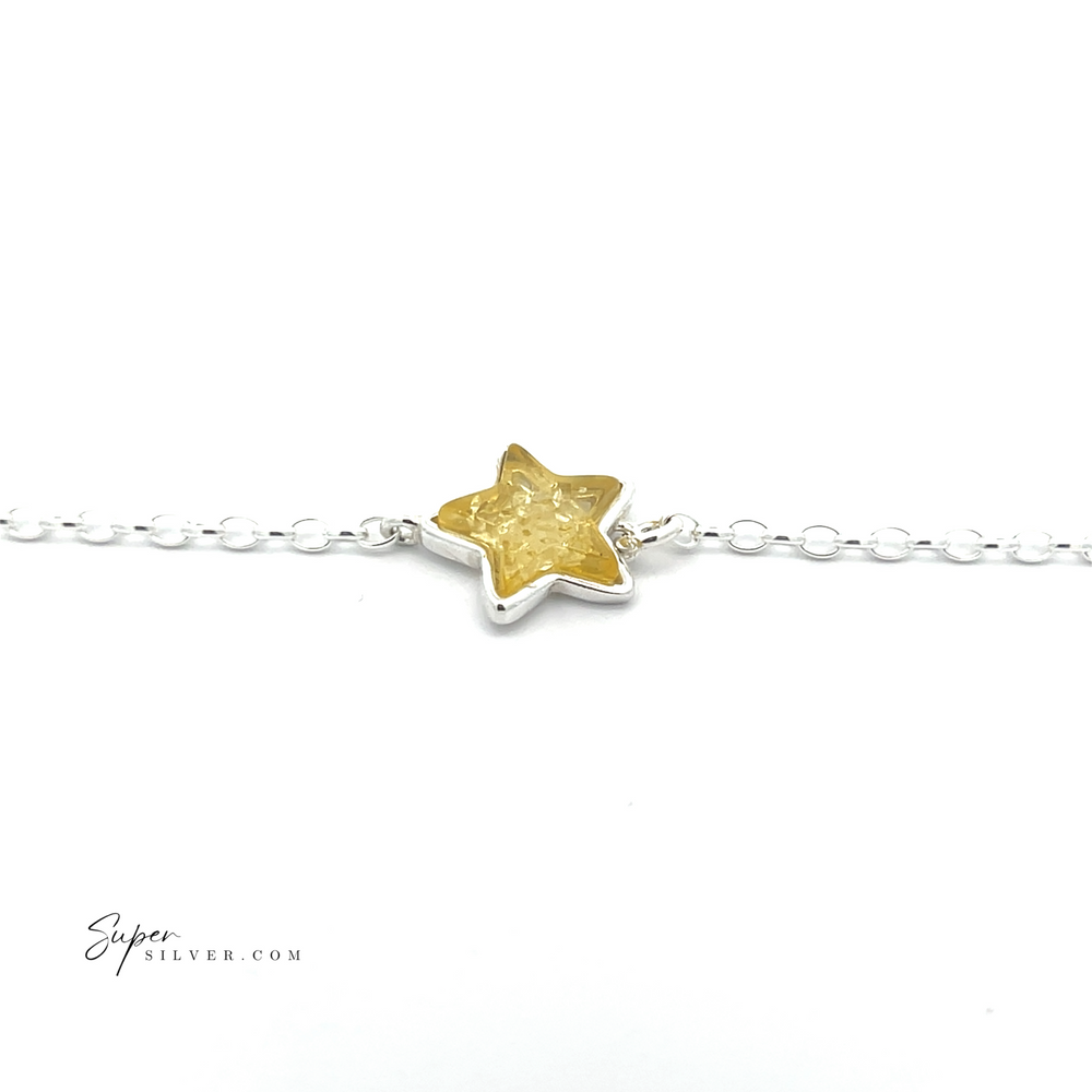 
                  
                    The Simple Amber Star Bracelet showcases a minimalist sterling silver chain with a vibrant yellow star-shaped charm at its center.
                  
                