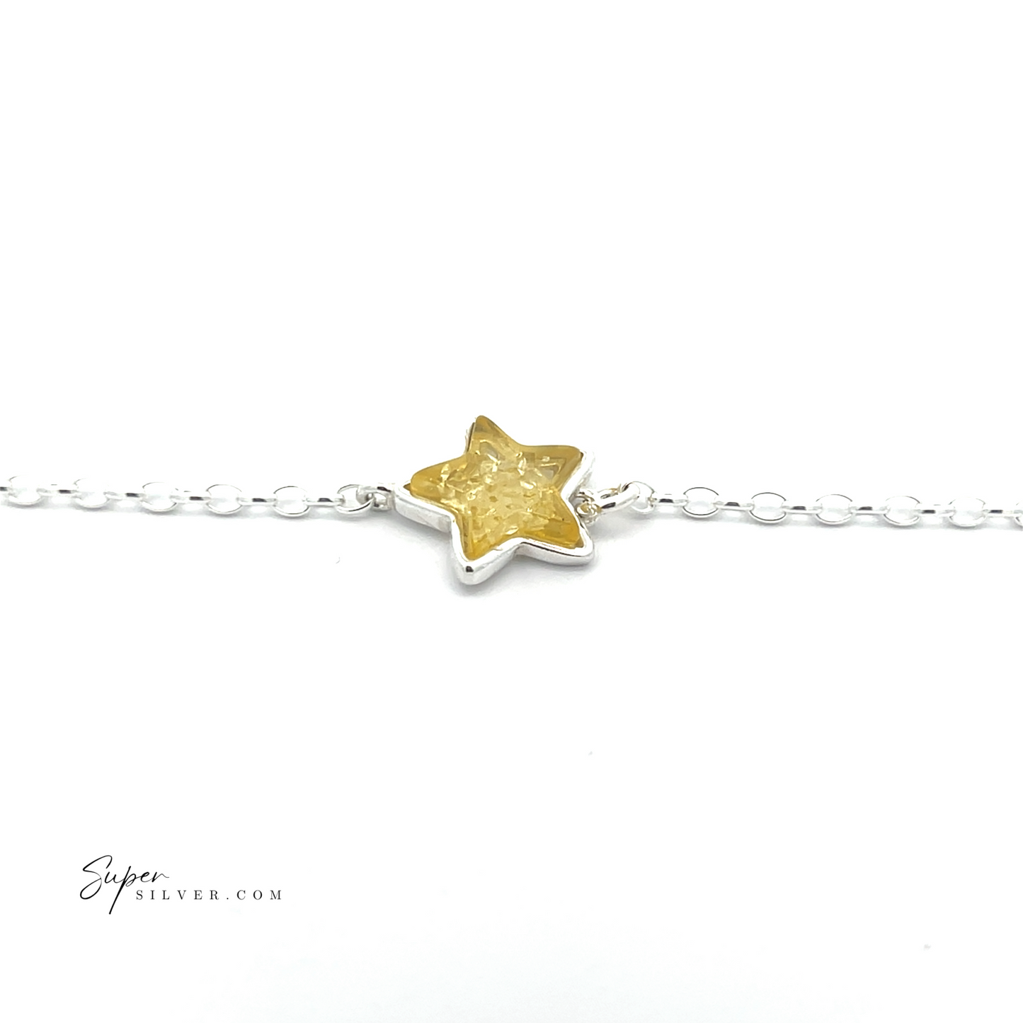 
                  
                    The Simple Amber Star Bracelet showcases a minimalist sterling silver chain with a vibrant yellow star-shaped charm at its center.
                  
                