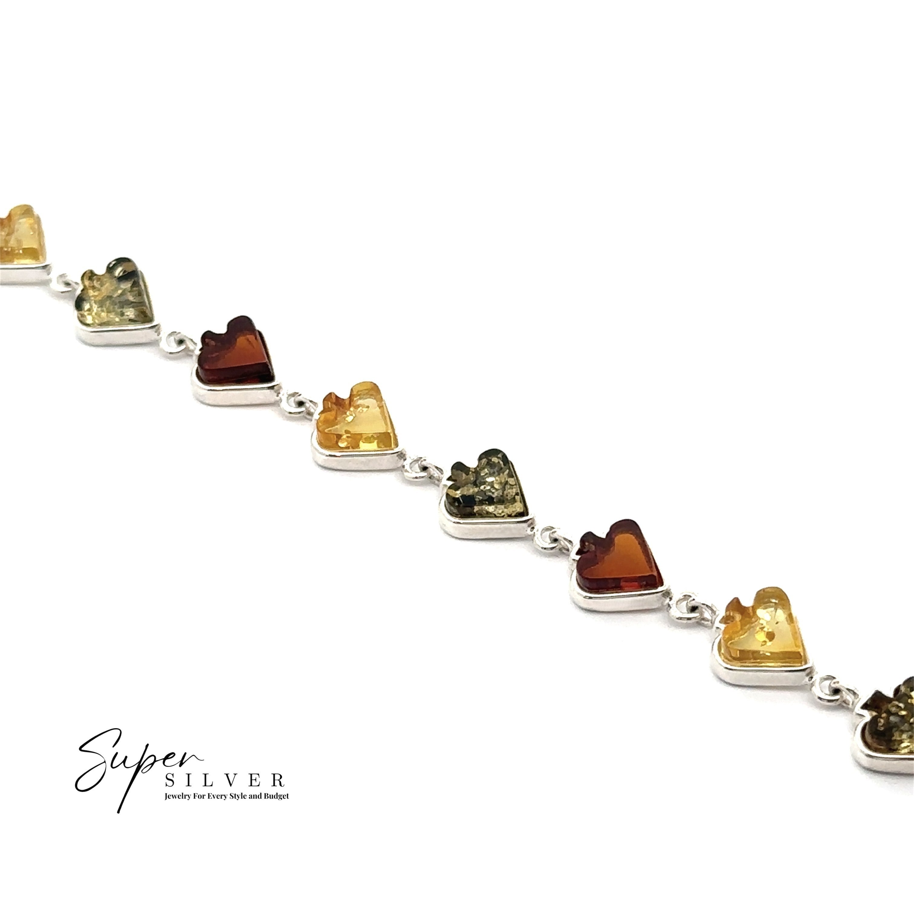 The Amber Card Suit Bracelets are sterling silver with alternating heart-shaped amber stones in yellow, green, and orange on a white background. The "Super Silver" logo is shown in the lower left corner.