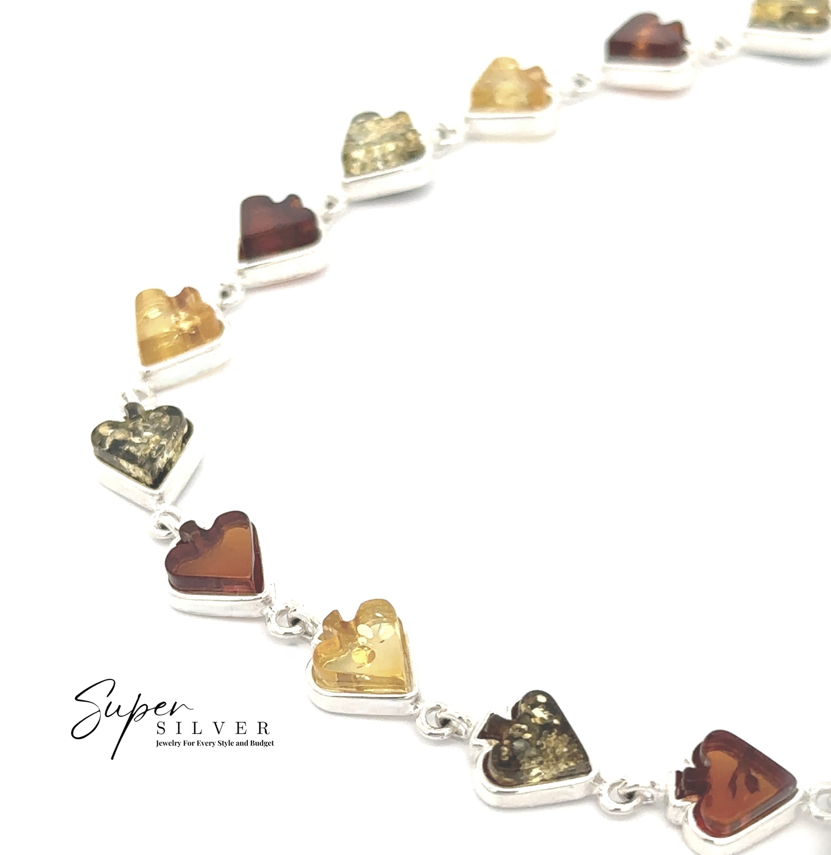 The Amber Card Suit Bracelet is a sterling silver bracelet with heart-shaped Baltic amber stones in yellow, gold, and brown hues, shown on a white background.