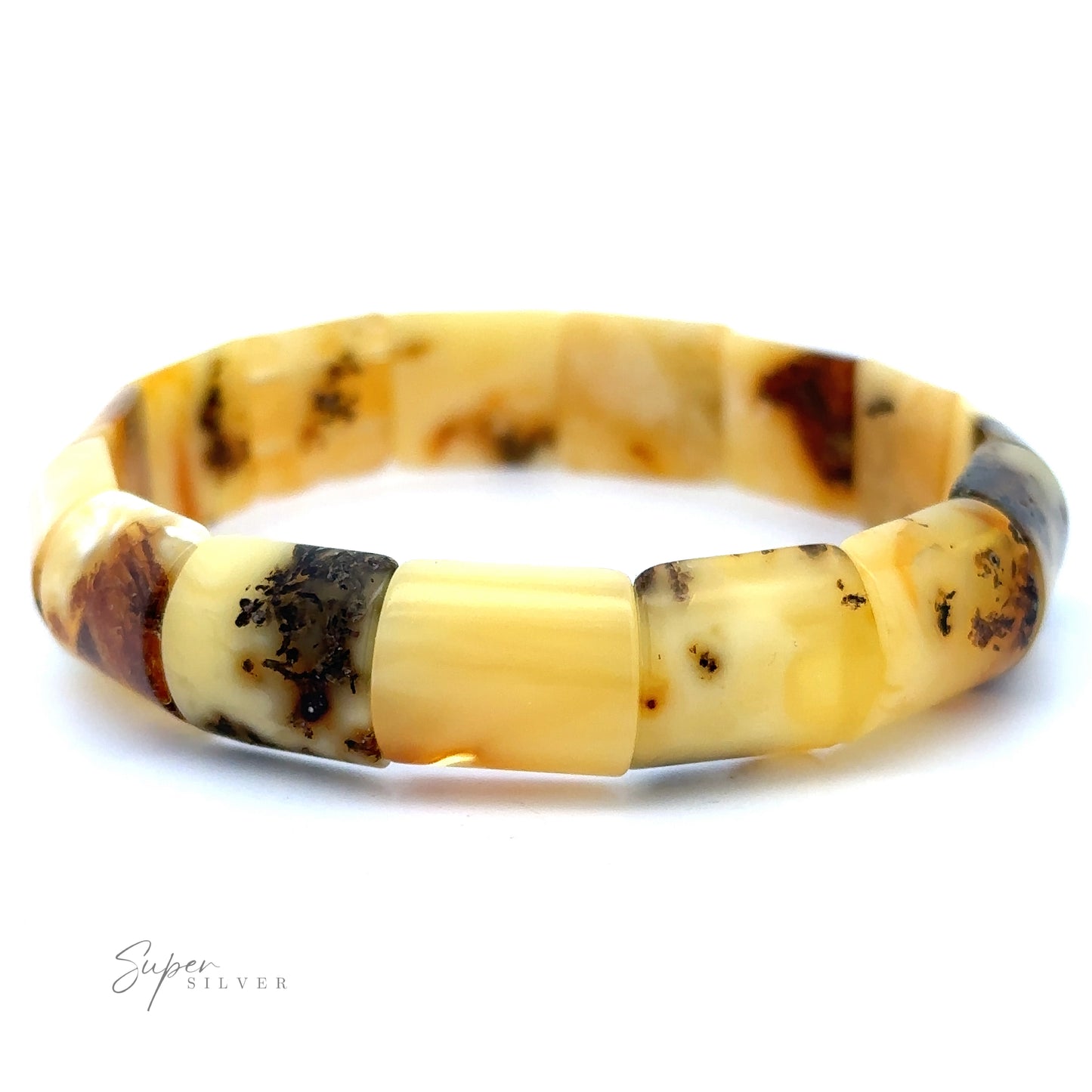 A close-up of a polished Brilliant Butterscotch Amber Stretch Bracelet composed of various shades of yellow and brown butterscotch beads, arranged in a circular fashion on a white background.