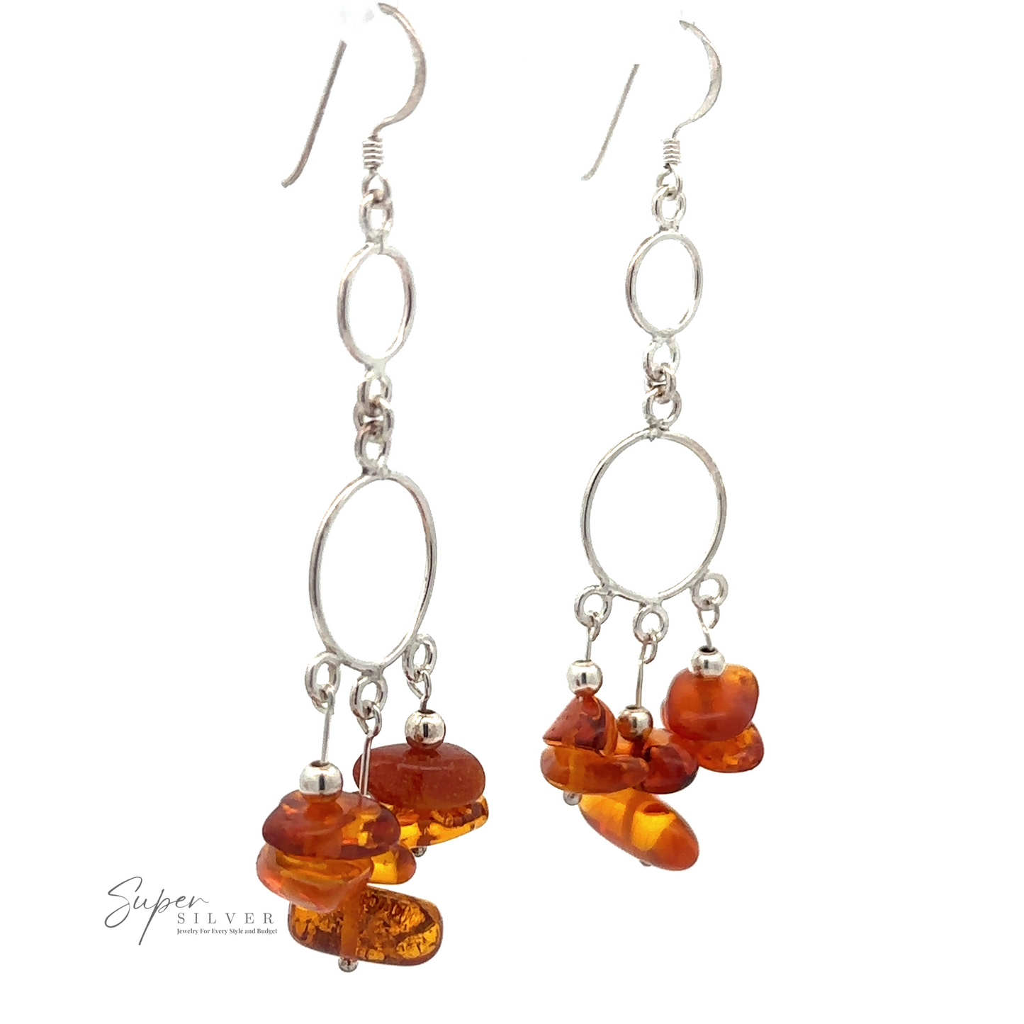 A pair of Hoop Dangle Earrings with Amber featuring Baltic amber stones and oval loops. The Hoop Dangle Earrings with Amber have dangling amber clusters at the bottom. Logo "Super Silver" appears in the lower left corner.