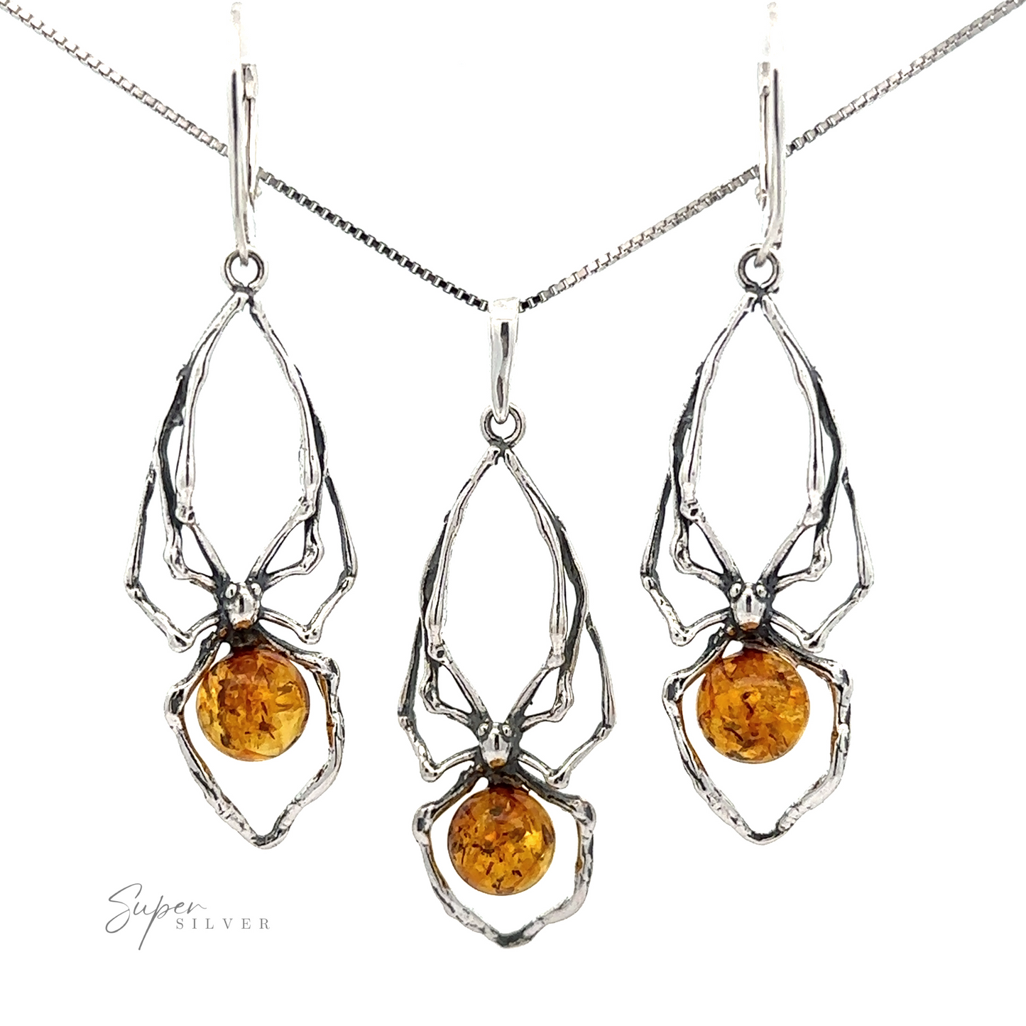 A set of sterling silver Beautiful Amber Spider Pendant jewelry with Baltic amber stones, including a spider pendant and a pair of earrings.