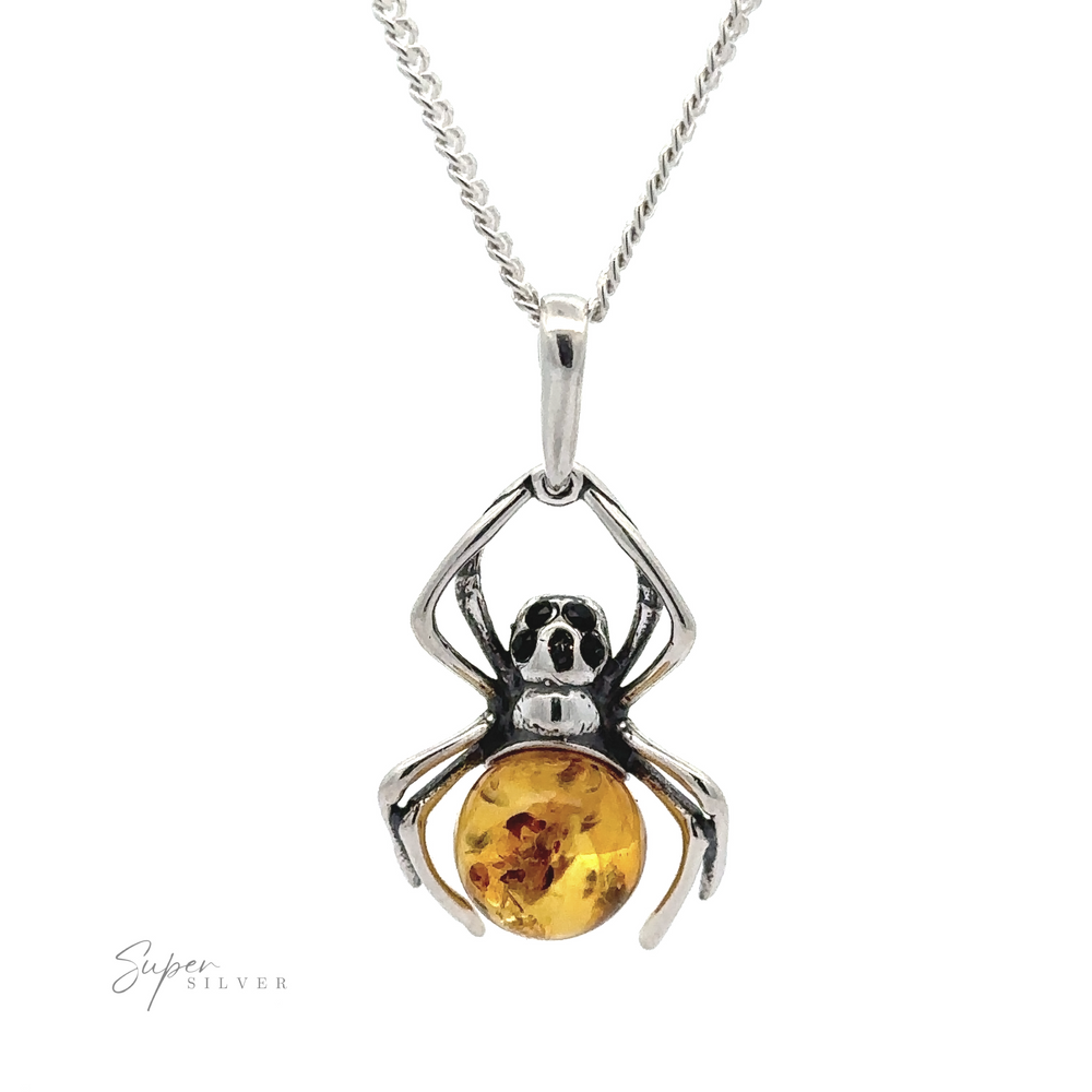 
                  
                    A Baltic Amber Spider Pendant with Onyx Eyes featuring a gothic design of a spider holding an amber gemstone, with onyx eyes adding an extra touch of dark elegance.
                  
                