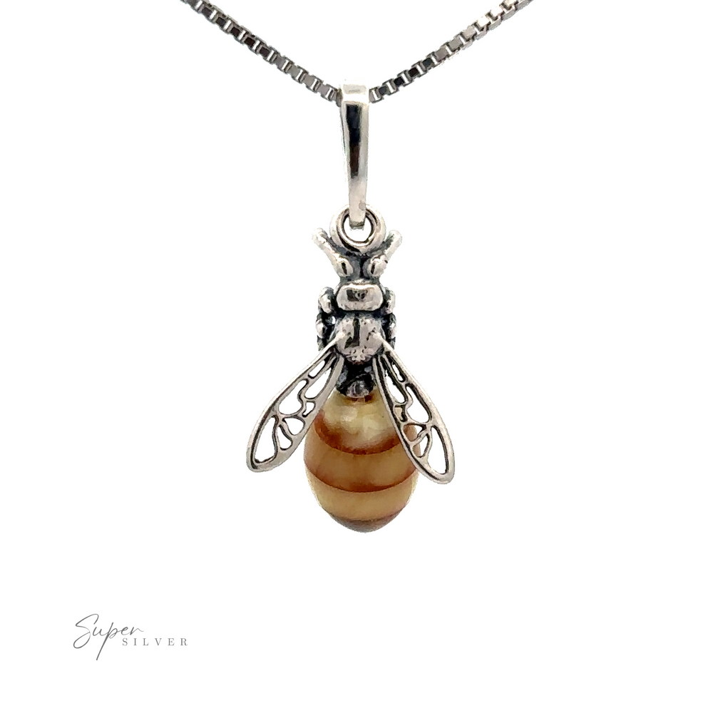 A Beautiful Amber Yellow Jacket Pendant, featuring a striped, brown and beige Baltic amber stone as its body, displayed against a plain white background.