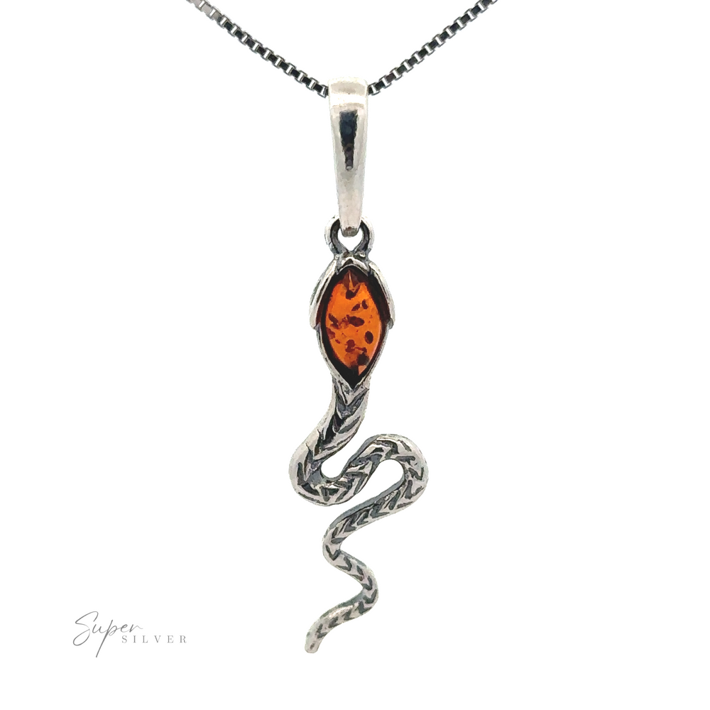 A sterling silver Alluring Amber Snake Pendant featuring a Baltic amber gemstone at its head, gracefully attached to a chain.