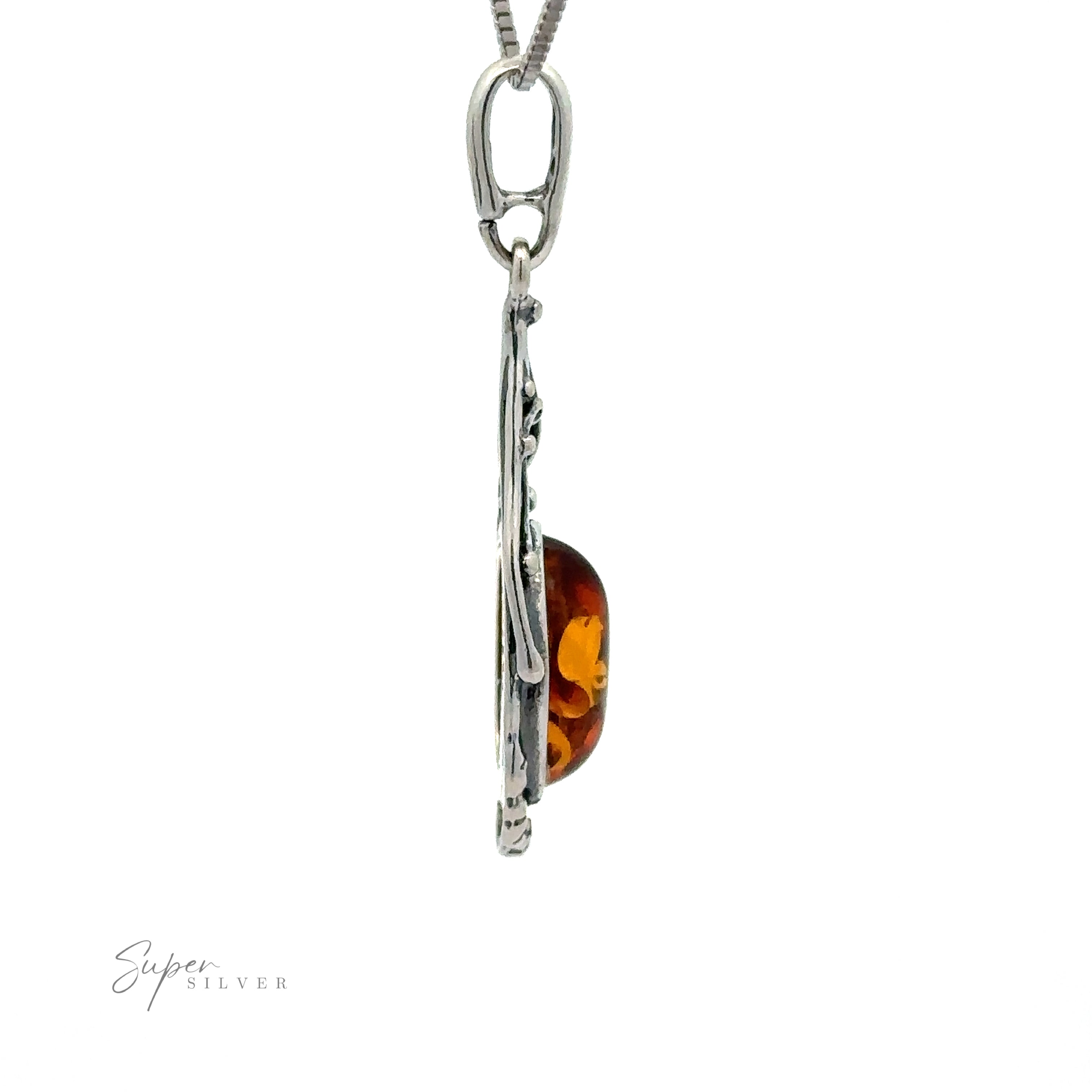Side view of a vintage-styled pendant with an amber gemstone in a silver setting on a silver chain. The words "Antique Style Amber Pendant" are visible in the corner.