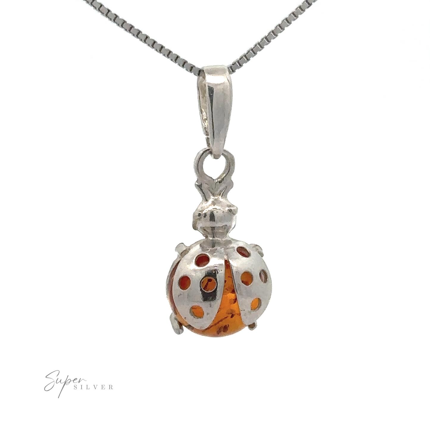 A sterling silver necklace with an Amber Ladybug Pendant, showcasing vibrant red spots and a shimmering cognac Baltic amber body.