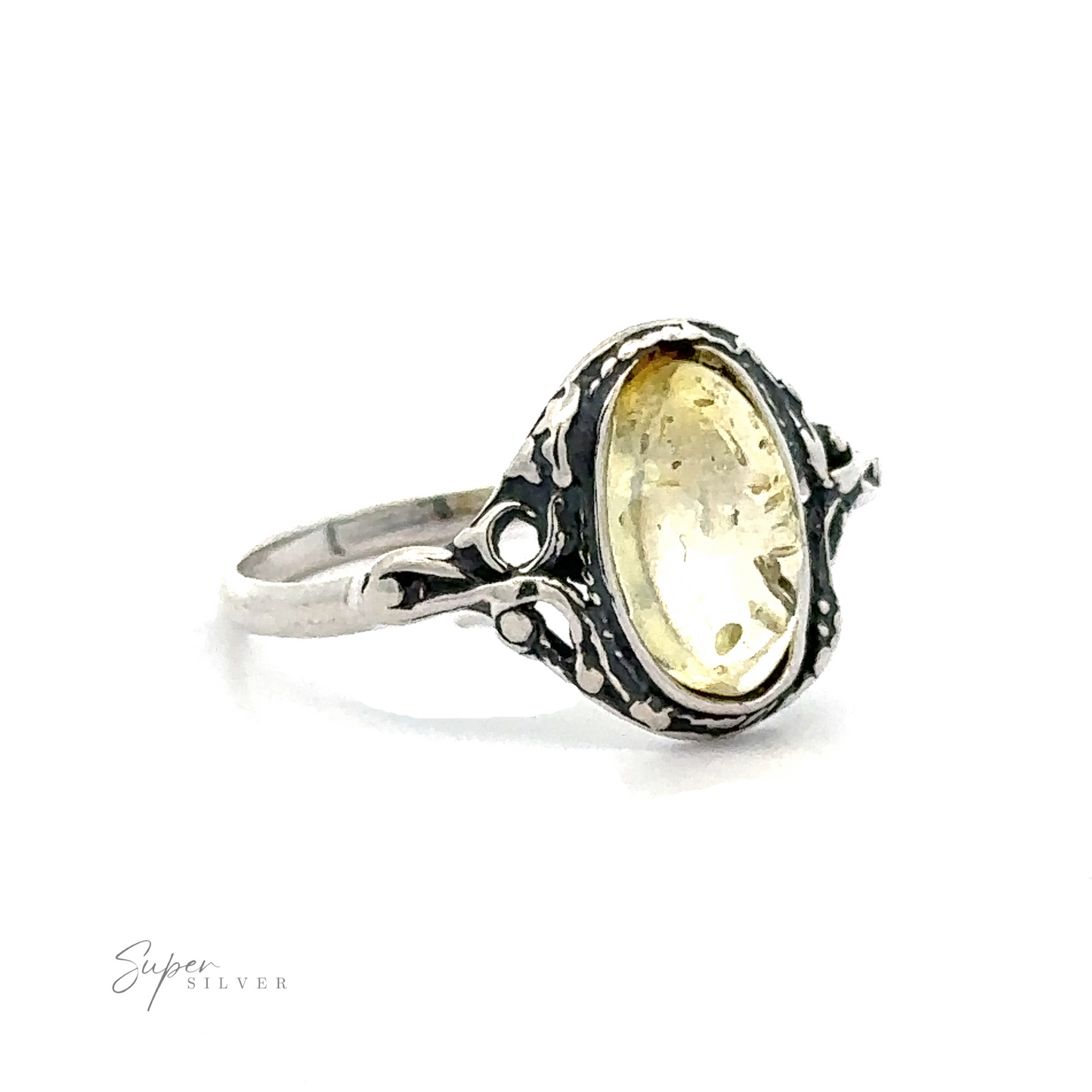 
                  
                    A vintage sterling silver ring featuring an oval Delicate Baltic Amber gemstone, set against a white background.
                  
                