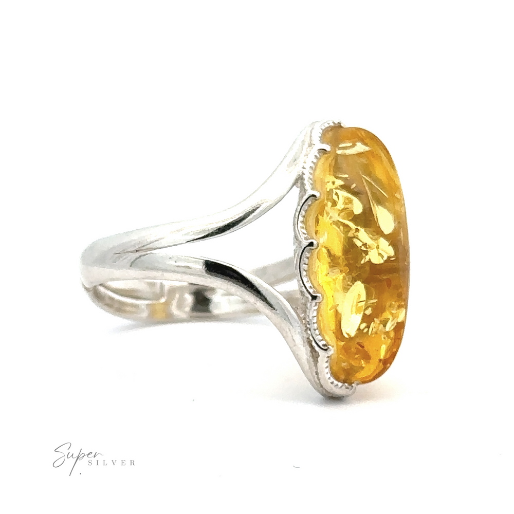 
                  
                    Close-up of a Marquise-Shaped Baltic Amber Adjustable Ring featuring a yellow gemstone. The adjustable band splits into two as it nears the stone, which has a slightly textured surface.
                  
                