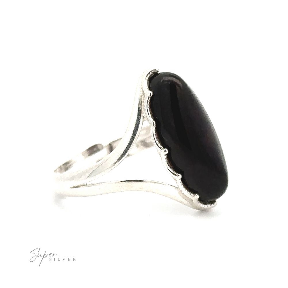 
                  
                    A Marquise-Shaped Baltic Amber Adjustable Ring featuring a large oval black stone set in a simple, adjustable band, with minimal decorative detailing.
                  
                