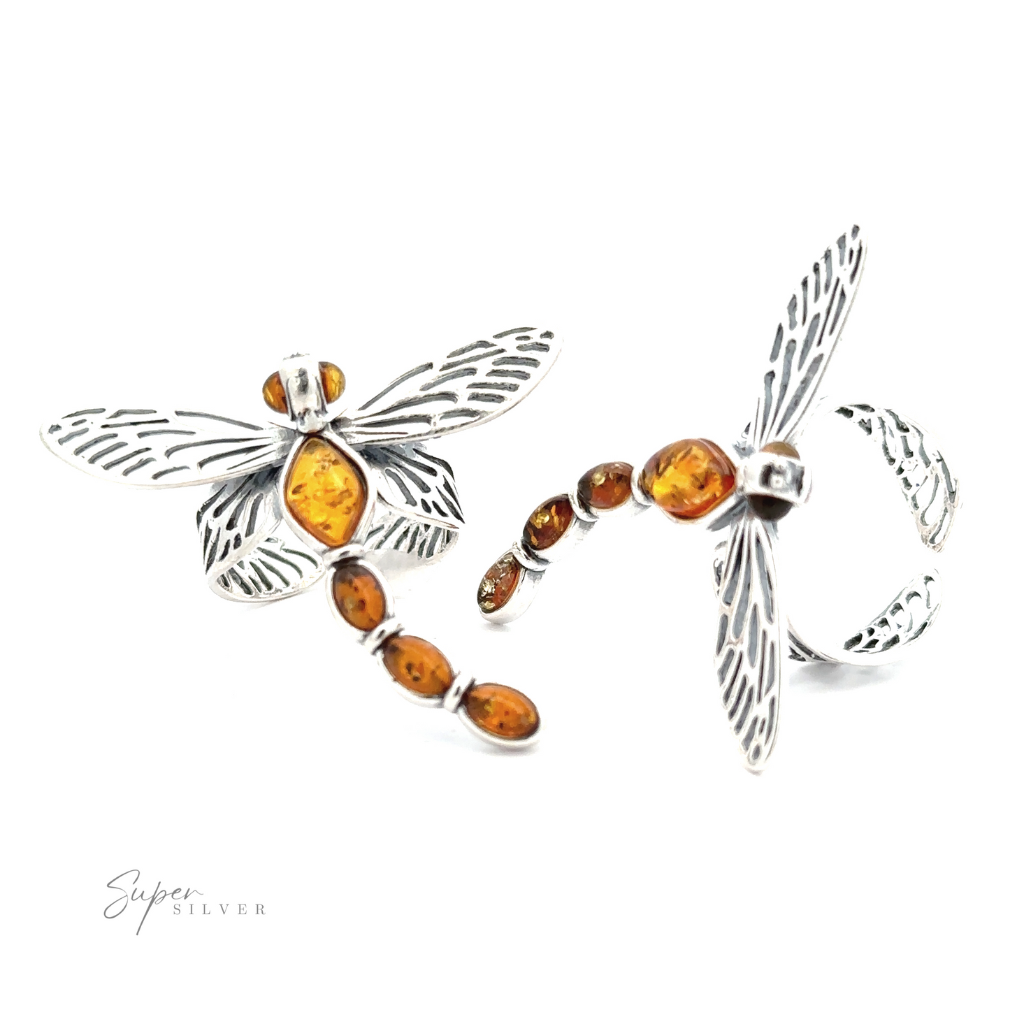 This Amber Dragonfly Adjustable Ring showcases a dragonfly-shaped silver design adorned with cognac amber stones, featuring detailed wing engravings and a segmented body. Perfect for lovers of nature-inspired jewelry.