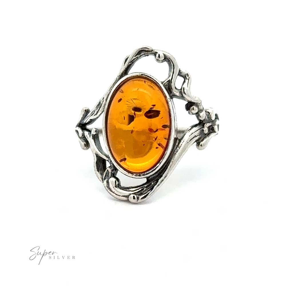 
                  
                    An Amber Ring with Vine Detailing featuring an oval amber stone with an intricate vine design, exuding antique allure.
                  
                