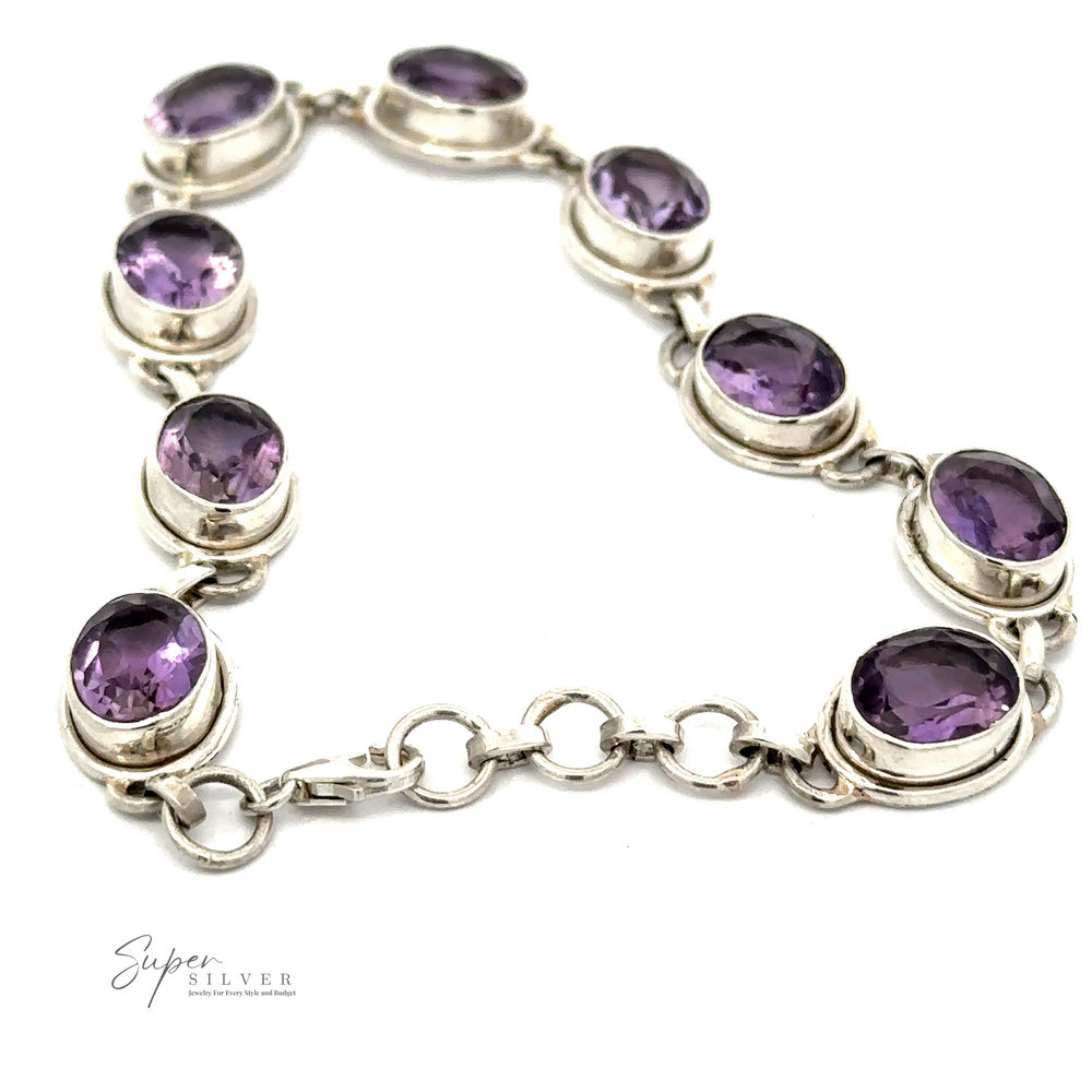 Introducing the Stunning Amethyst Bracelet, crafted from sterling silver and featuring oval purple gems set in a linked design—ideal for making a bold statement.