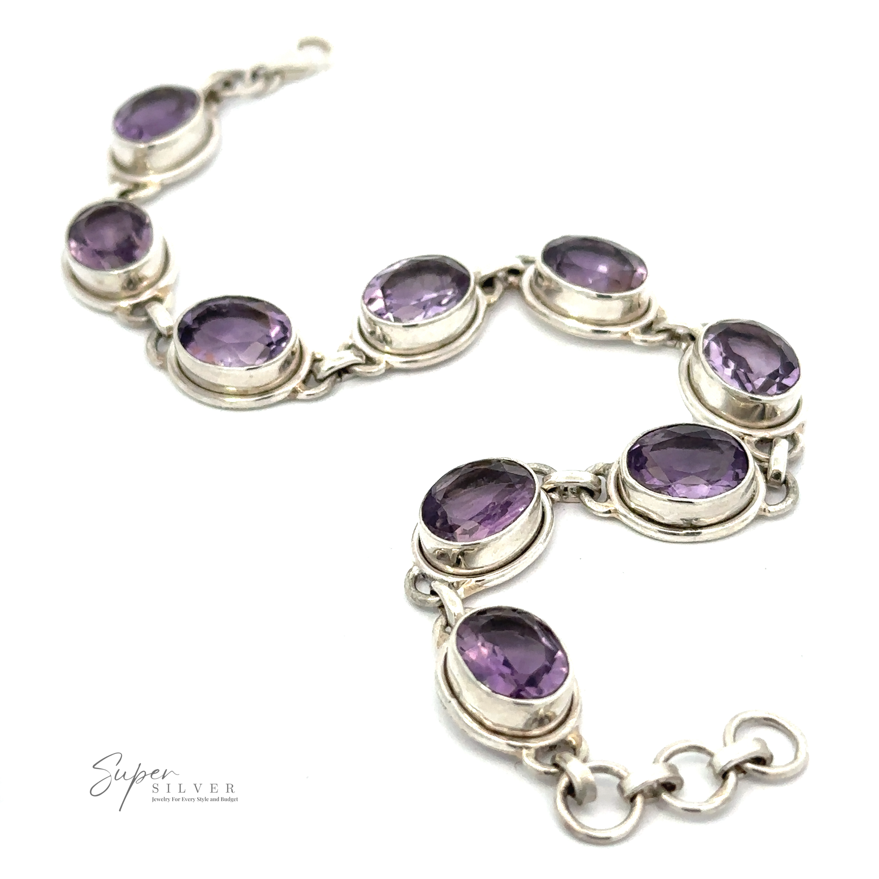 The Stunning Amethyst Bracelet is a sophisticated piece made of sterling silver, featuring seamlessly linked oval purple gemstones.