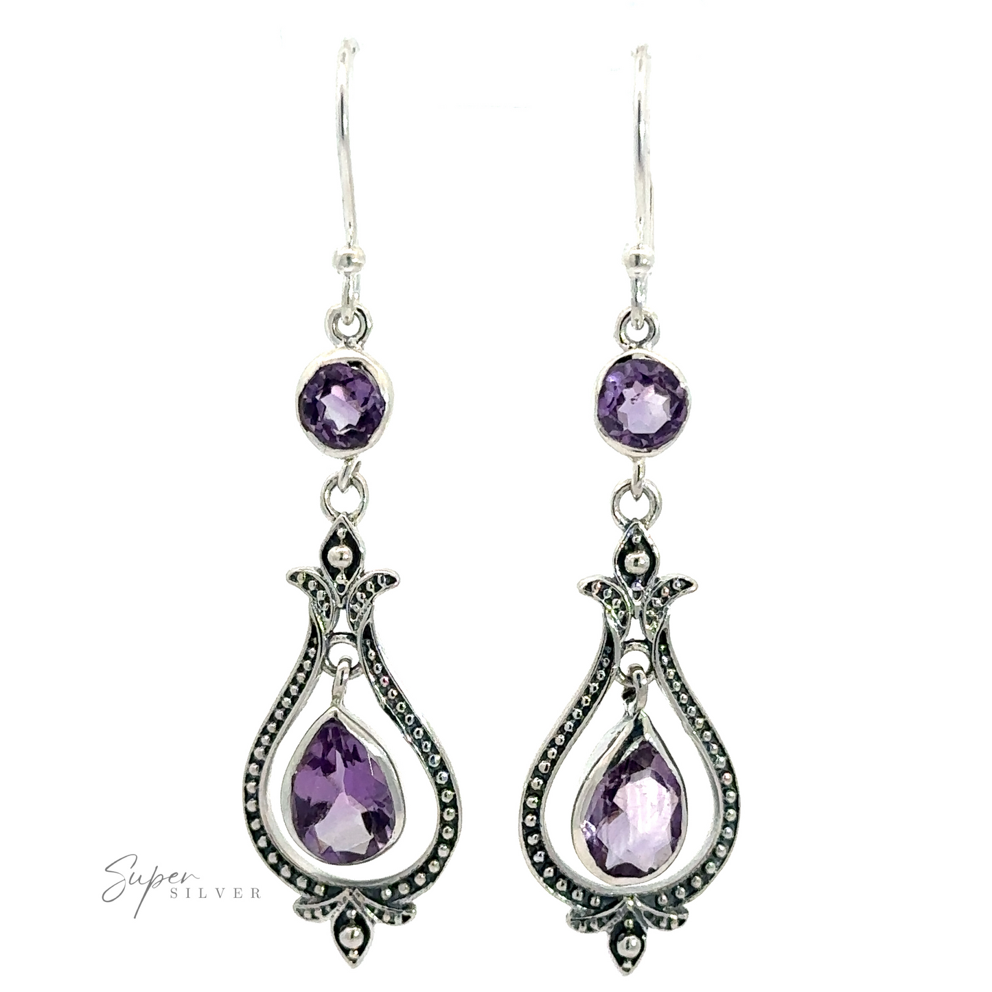 
                  
                    A pair of Vintage-Styled Teardrop Earrings with Gemstones featuring small round purple gemstones at the top and larger teardrop-shaped purple gemstones, all encased in an ornate, .925 sterling silver design.
                  
                