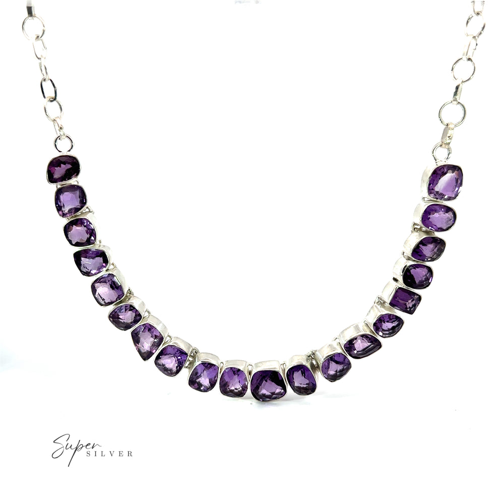 
                  
                    A Statement Gemstone Necklace with a sequence of faceted purple amethysts, arranged in a graduated pattern, is displayed against a white background. The image includes the text "Super Silver" in the bottom left corner.
                  
                
