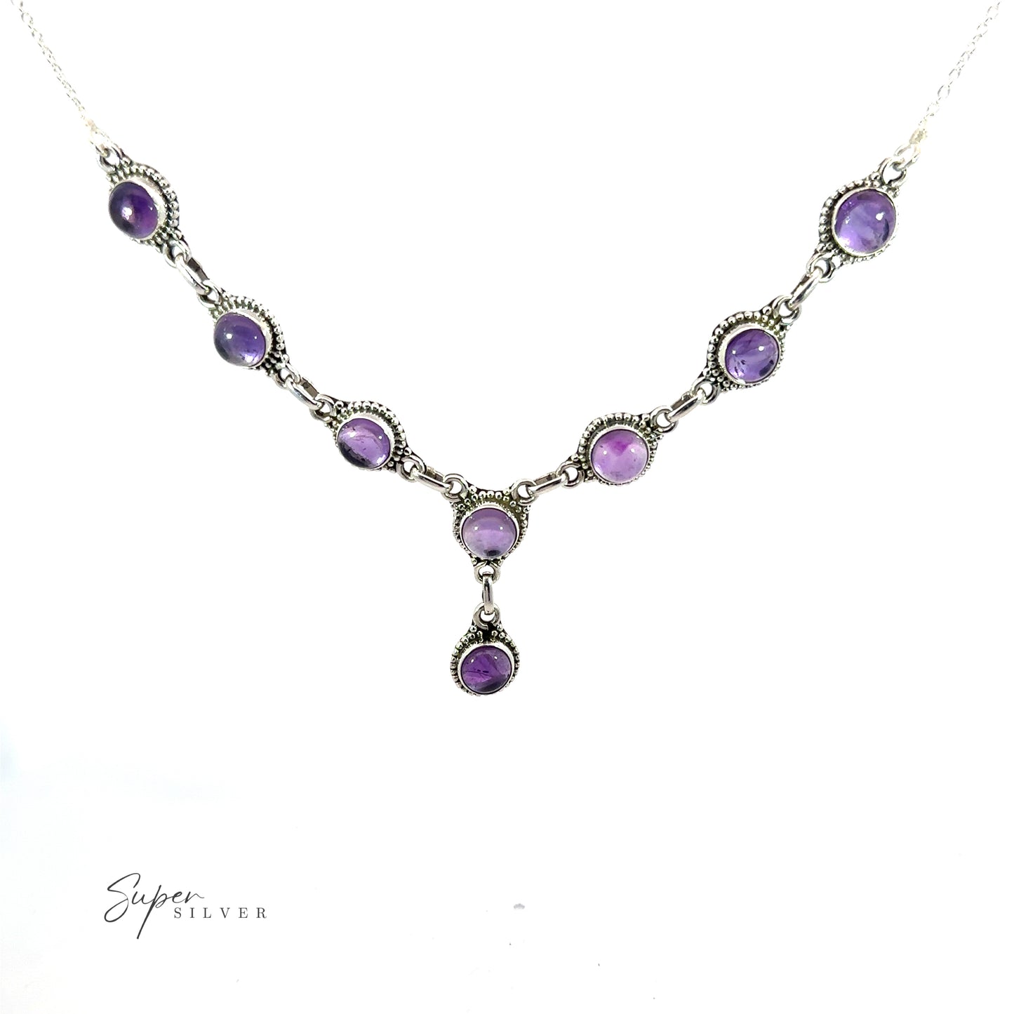 
                  
                    A Round Gemstone Y Necklace with Ball Border necklace with a series of round, purple gemstone pendants set in intricate silver settings, featuring one drop-shaped pendant at its center. This exquisite piece of bohemian style jewelry is branded "Super Silver" in the bottom left corner.
                  
                