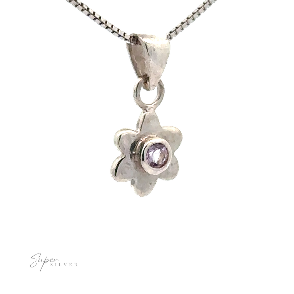 
                  
                    A stunning Tiny Gemstone Flower Pendant hanging on a delicate chain necklace against a pristine white background.
                  
                