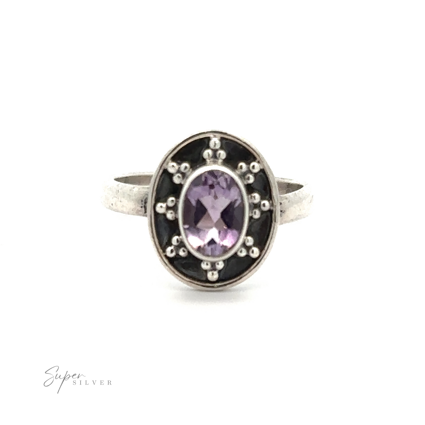 
                  
                    An Oval Gemstone Ring with Ball and Disk Border featuring an oval-shaped purple gemstone set in the center, surrounded by small silver bead details. This vintage-inspired jewelry piece stands out beautifully against the plain white background.
                  
                