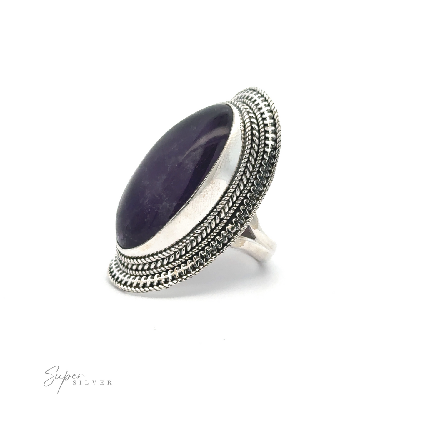 
                  
                    Large Oval Shield Gemstone Ring with a large oval purple gemstone set into an ornate bezel. The detailed metalwork around the stone adds a bohemian flair to this stunning piece. "Super Silver" is written in the bottom left corner.
                  
                