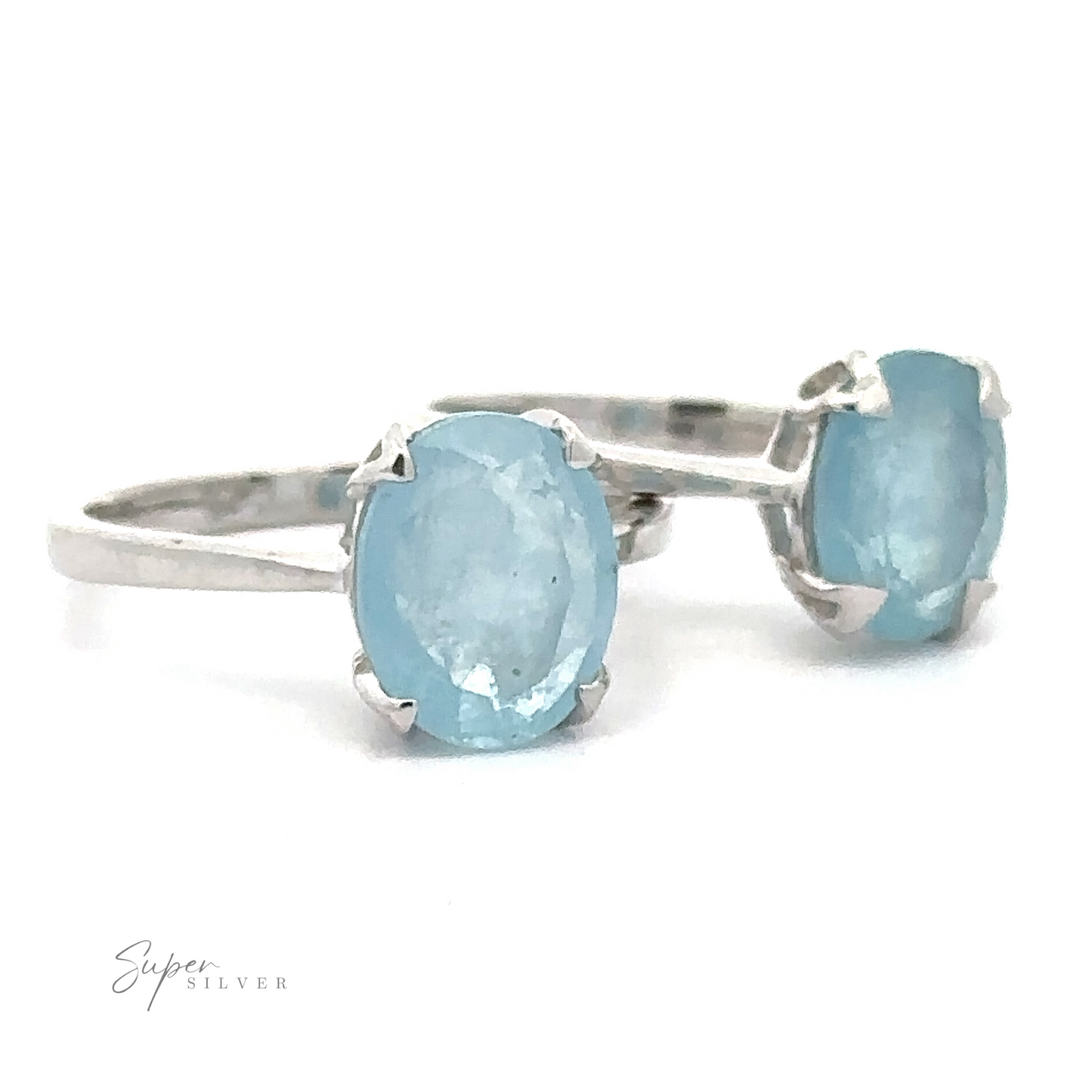 Aquamarine Ring with two light blue Aquamarine gemstones, displayed against a white background with a logo reading "Super Silver" in script.