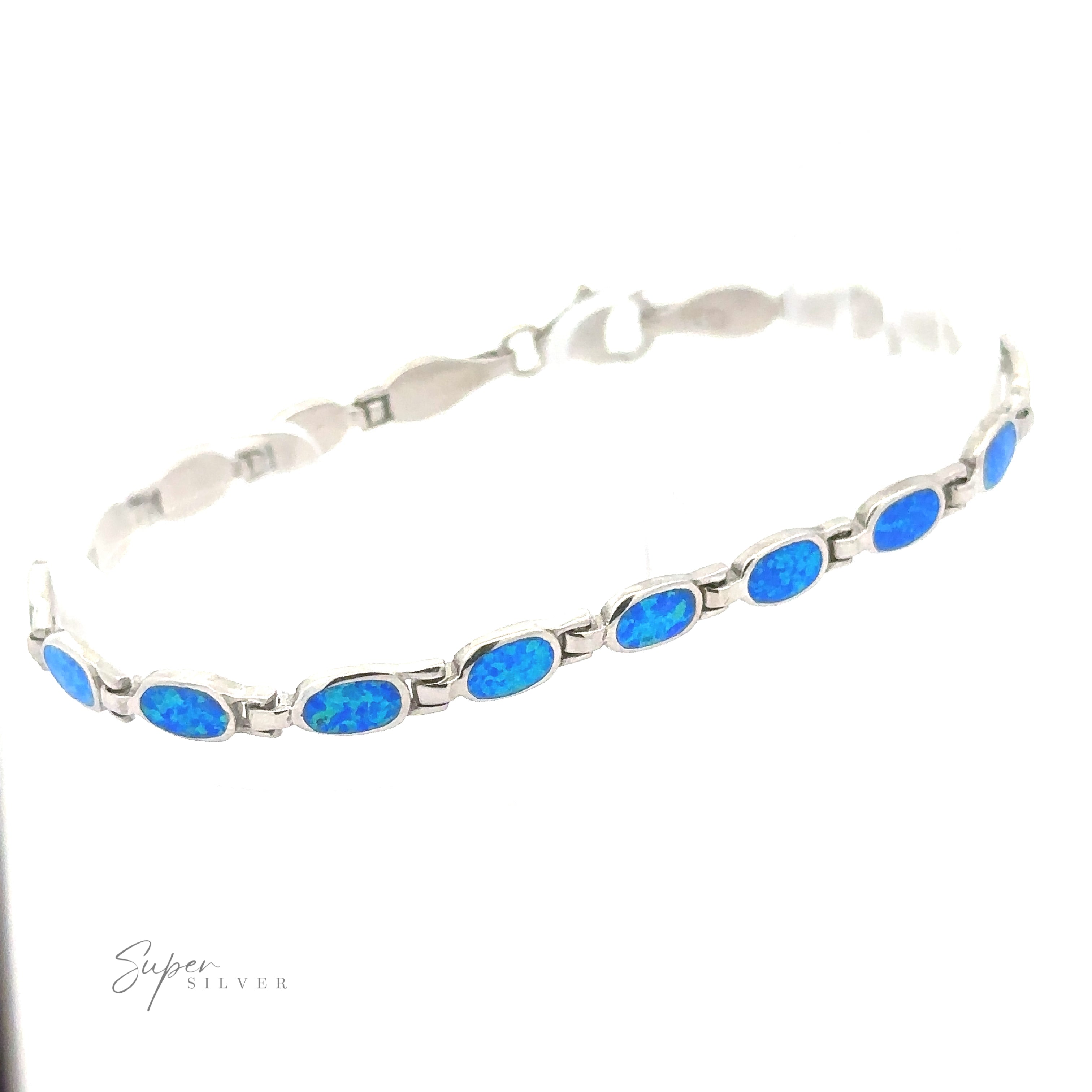 Introducing the Oval Lab-Created Opal Bracelet, exuding modern elegance and accented with .925 Sterling Silver, beautifully displayed against a pristine white background.