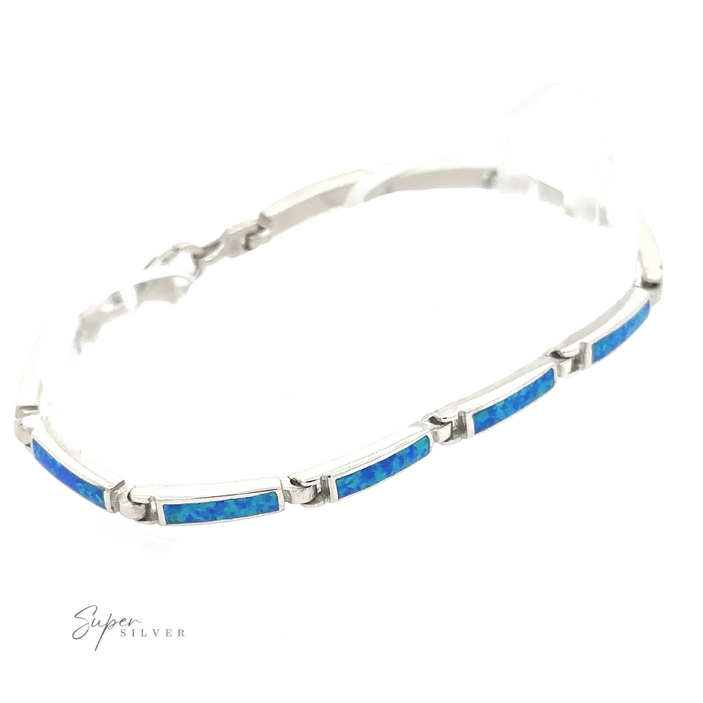 
                  
                    The Long Rectangle Lab-Created Opal Bracelet is a part of the Opal Glow Jewelry collection, featuring rectangular blue opal inlays set in sterling silver and secured with a lobster clasp, all elegantly displayed on a white background.
                  
                