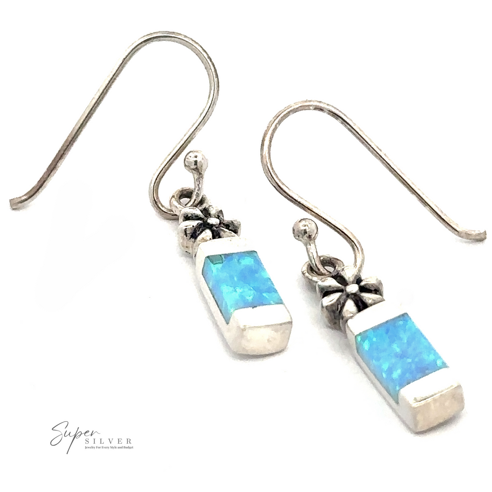 A pair of Blue Created Opal Earrings with Flower featuring rectangular blue opal stones with small star-shaped accents.