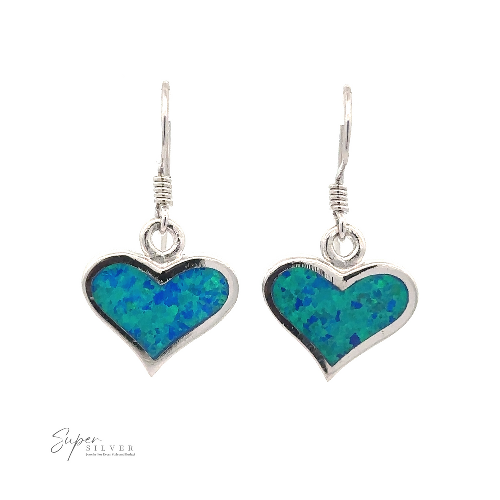 
                  
                    A pair of Lab-Created Opal Heart Earrings with blue and green speckled inlay, set in rhodium plated sterling silver, and hanging from hook wires.
                  
                