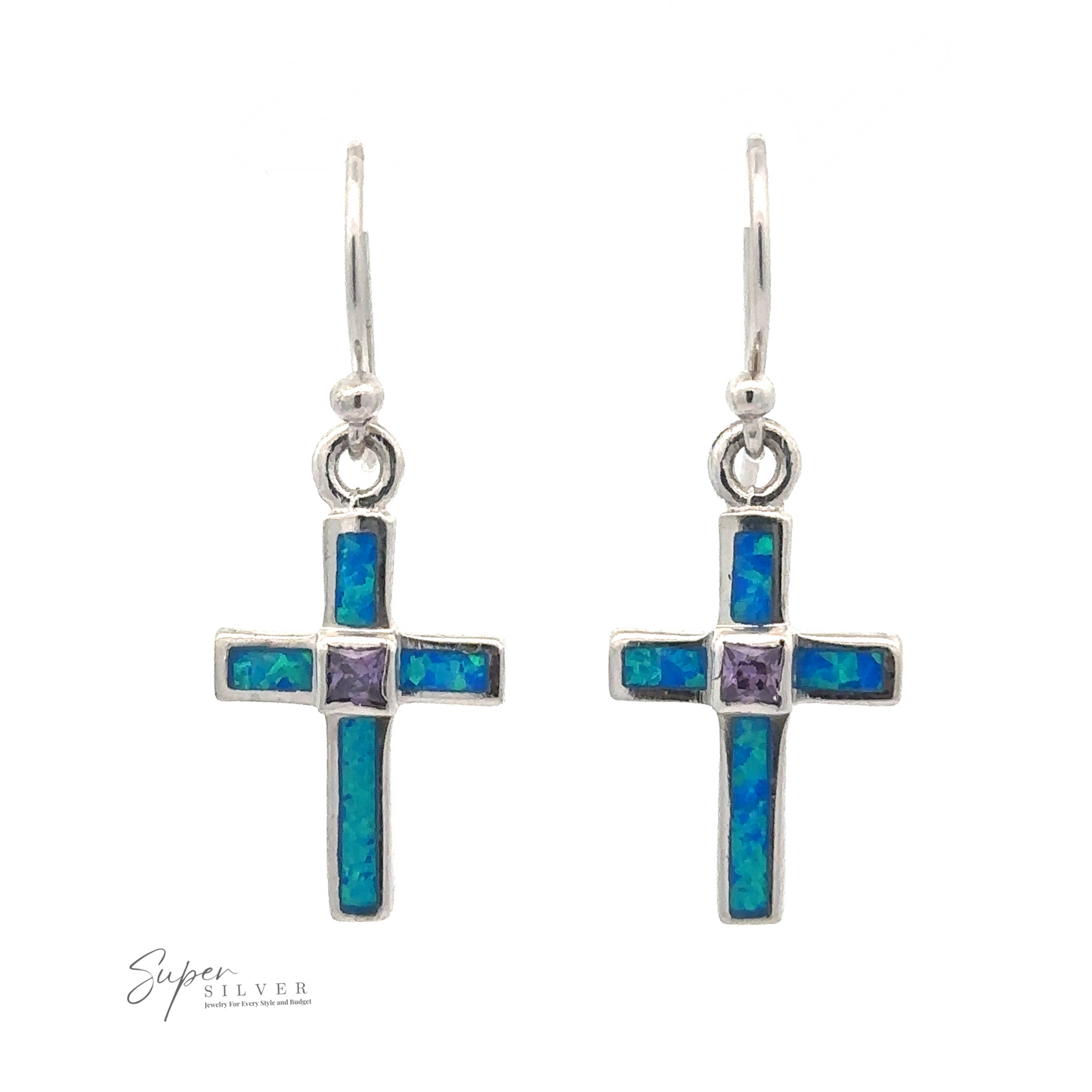 
                  
                    A pair of Blue Opal Cross Earrings With Amethyst Center Stone featuring blue and green inlaid stones with a small pink stone in the center, hanging from silver hooks. The brand "Super Silver" is visible in the bottom left corner.
                  
                