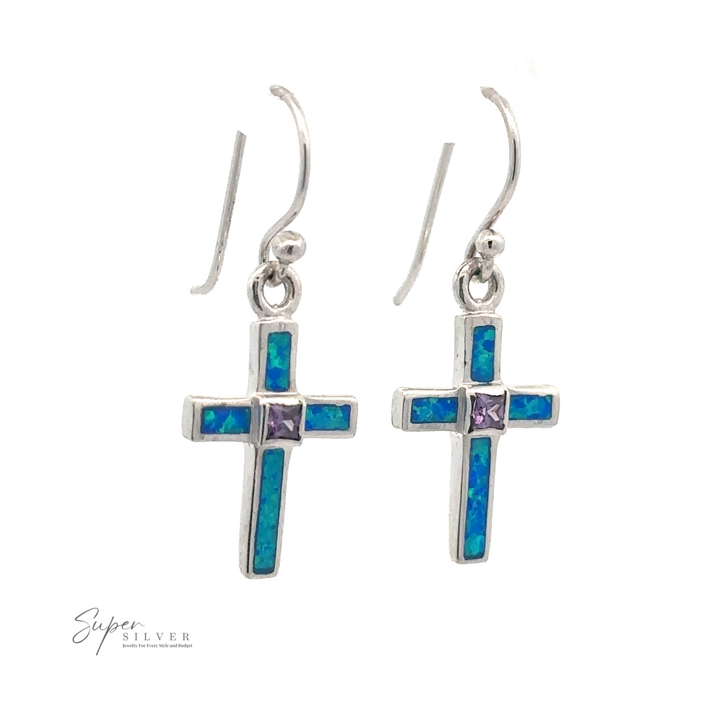 A pair of Blue Opal Cross Earrings With Amethyst Center Stone, hanging from simple sterling silver hooks. The image includes a "Super Silver" logo at the bottom left.
