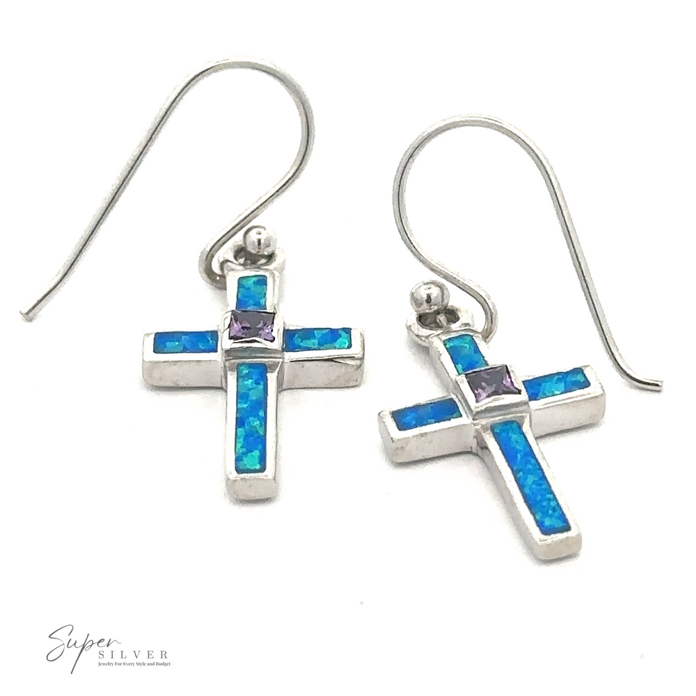 A pair of Blue Opal Cross Earrings With Amethyst Center Stone, with hook-style ear wires. 