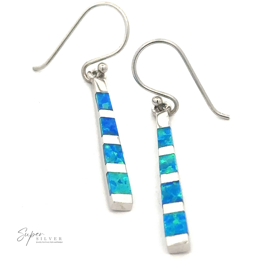 A pair of Blue Created Opal Rectangle Earrings with rectangular teal and blue mosaic inlays. The brand name 