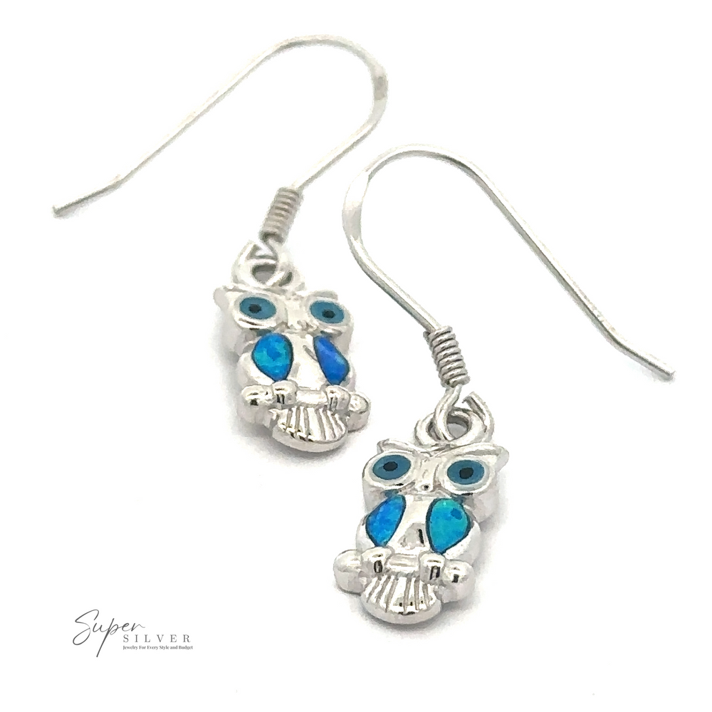 A pair of Lab-Created Opal Owl Earrings with blue and turquoise accents on a white background.