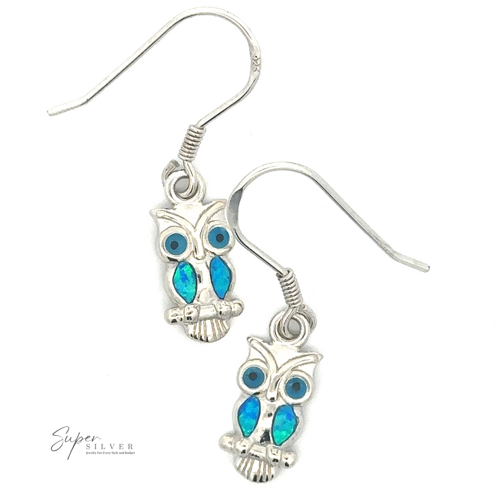 
                  
                    Lab-Created Opal Owl Earrings with vibrant blue inlays and hook fastenings, displayed elegantly on a white background. Perfect for those who adore owl jewelry.
                  
                