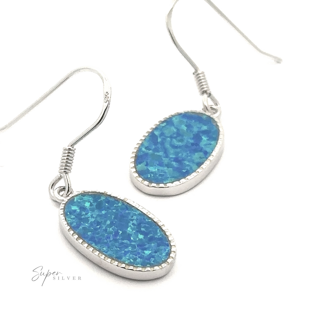 
                  
                    The Blue Oval Lab-Created Opal Earrings, featuring striking opals set on sterling silver hooks, create a perfect statement piece for any occasion.
                  
                