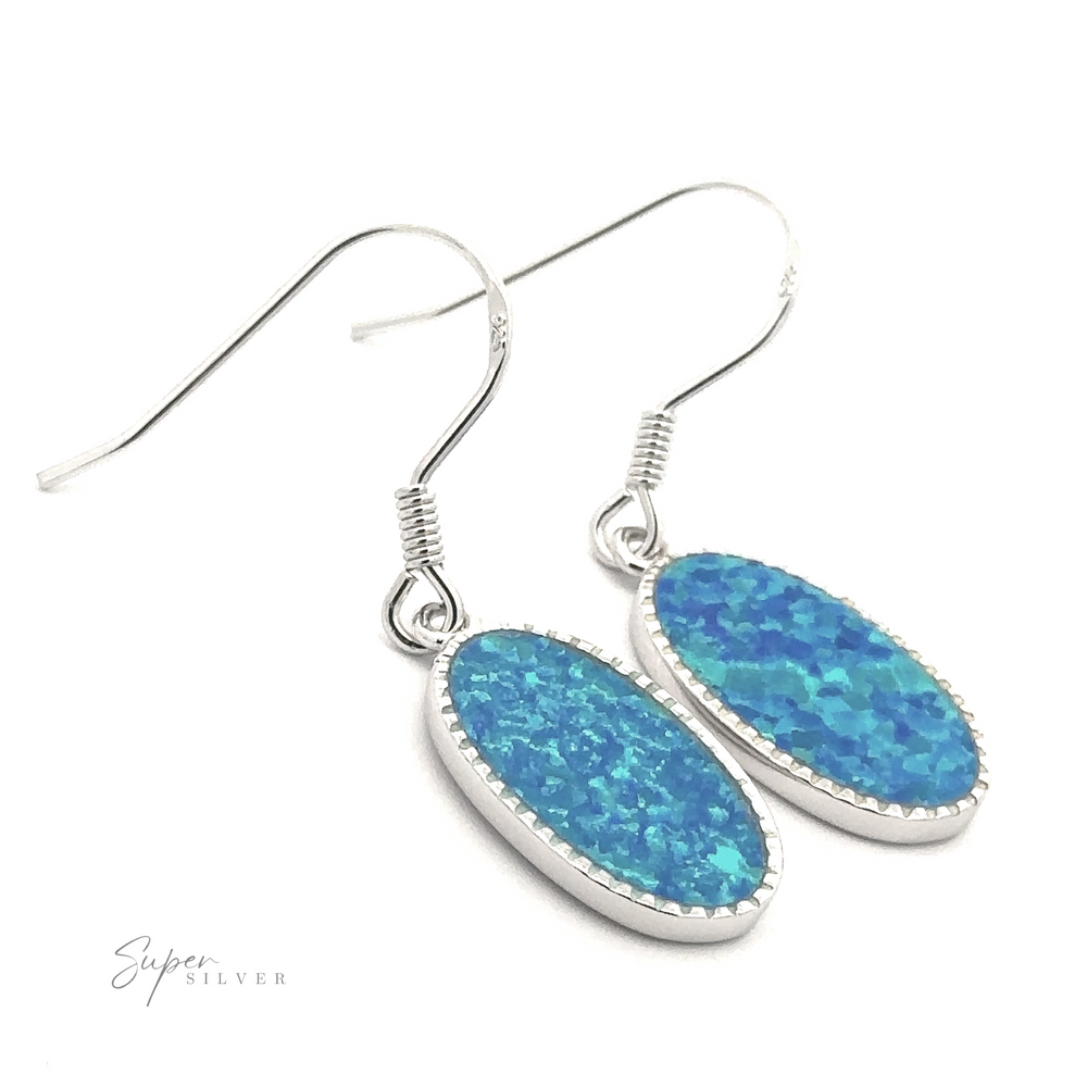 
                  
                    The Blue Oval Lab-Created Opal Earrings feature two captivating opal stones, elegantly dangling from sterling silver hooks, making a mesmerizing statement piece.
                  
                