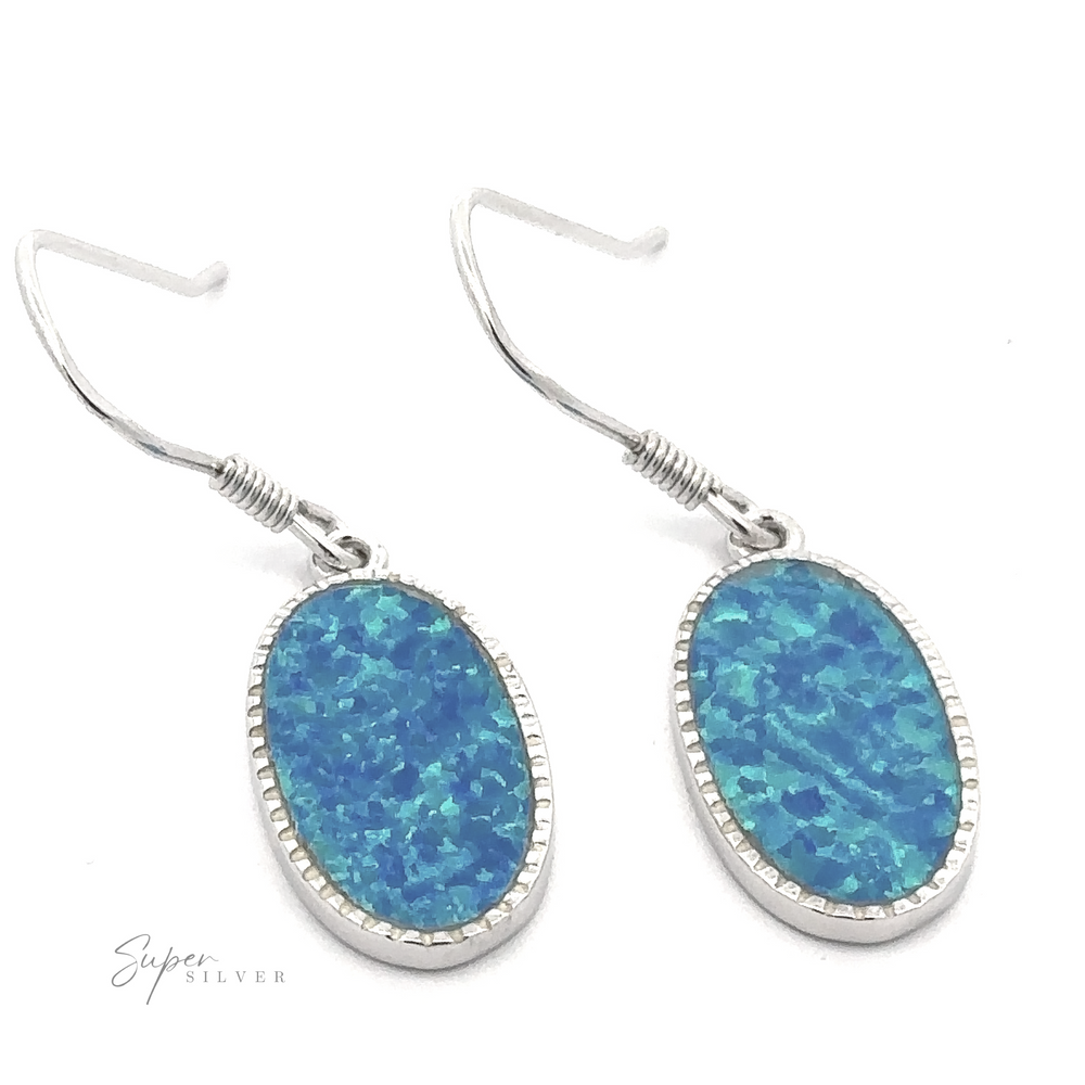 
                  
                    Pair of Blue Oval Lab-Created Opal Earrings in sterling silver with dangle design and hook-style closure.
                  
                