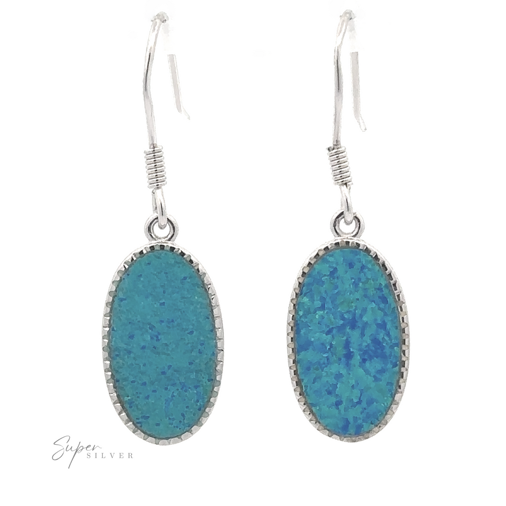 
                  
                    Introducing the Blue Oval Lab-Created Opal Earrings: Featuring striking blue-green lab-created opals set on sterling silver hooks, these earrings make a bold statement piece.
                  
                