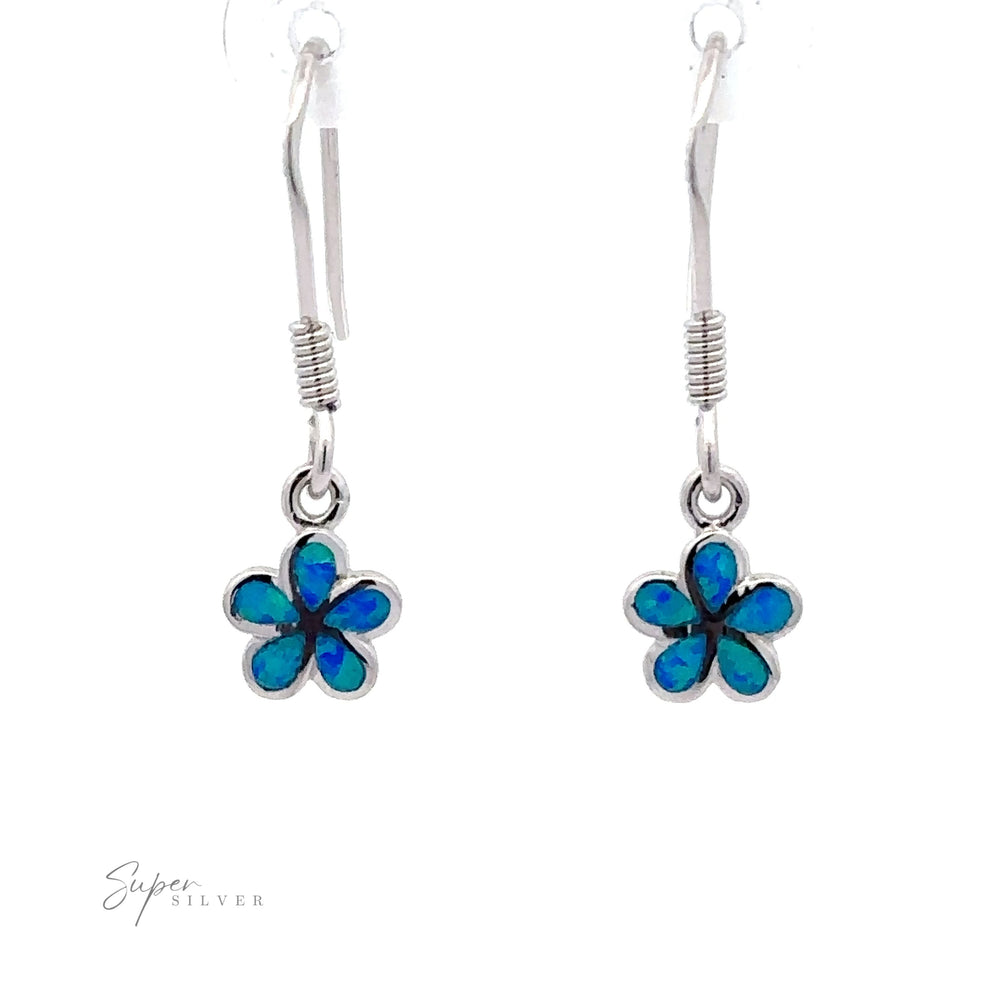 
                  
                    A pair of Small Plumeria Flower Lab-Created Opal Earrings with dangling blue-green flower-shaped pendants featuring petal-like inlays, reminiscent of Sterling Silver earrings.
                  
                