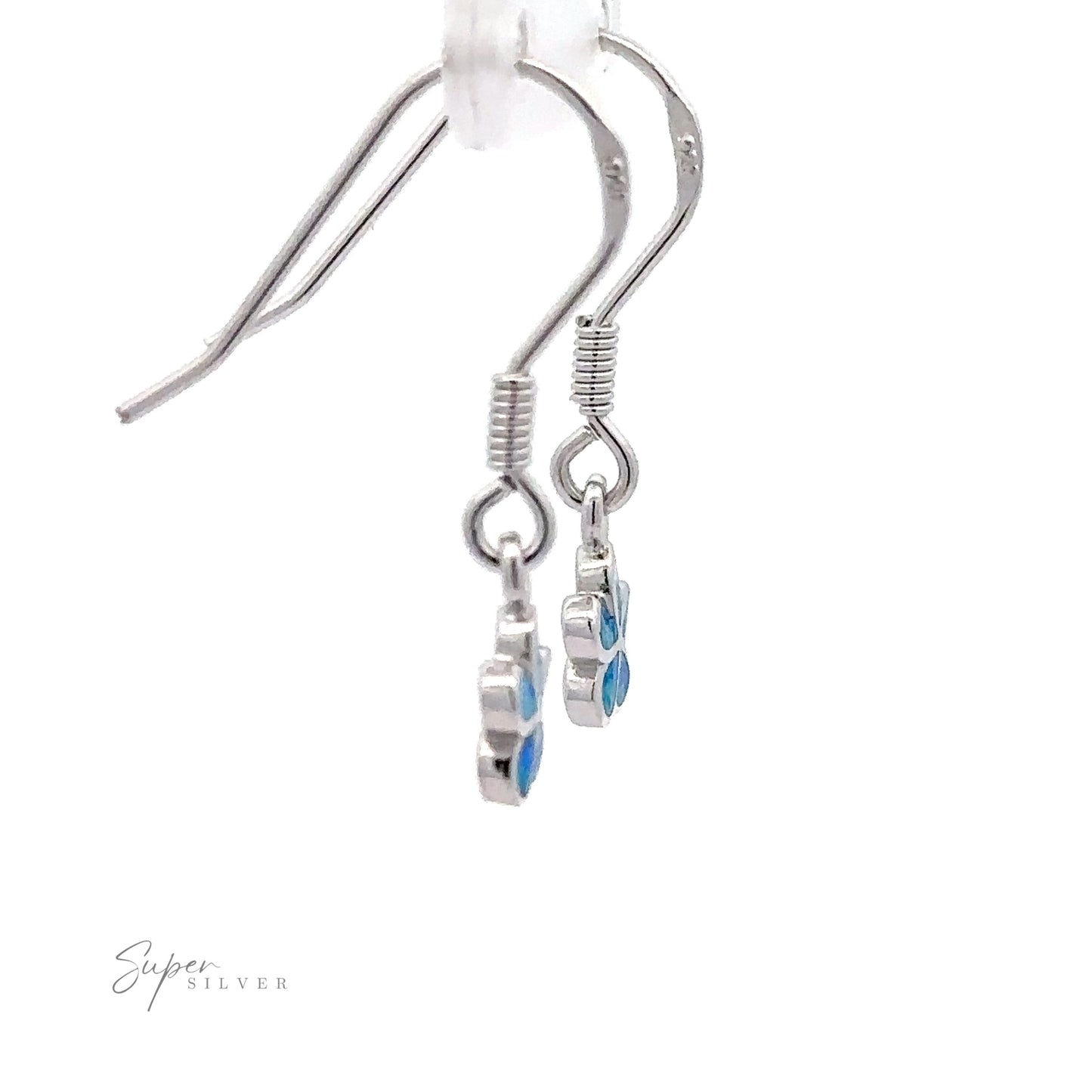 
                  
                    Close-up of Small Plumeria Flower Lab-Created Opal Earrings, featuring sterling silver with small blue flower-shaped charms hanging from hooks against a white background. The text "Super Silver" is present at the bottom left corner.
                  
                