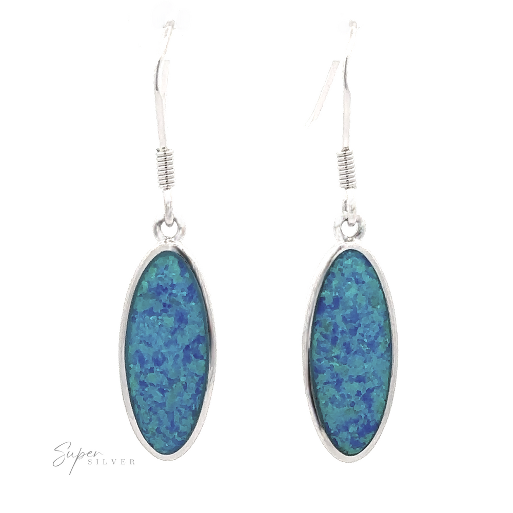 
                  
                    Introducing our Simple Oval Lab-Created Opal Earrings, featuring silver hooks and blue-green speckled stones accented with stunning lab-created opals.
                  
                